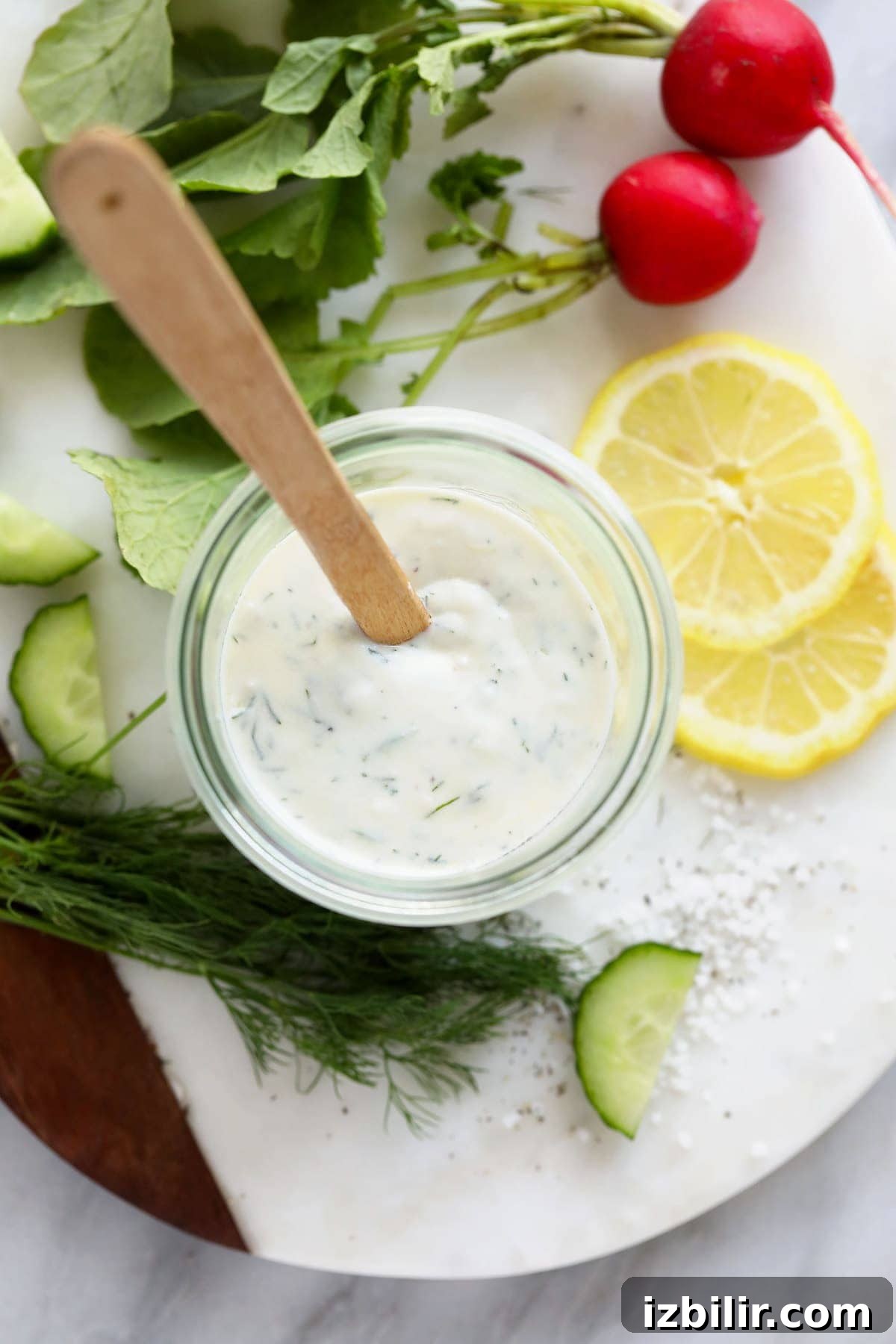 Dressing in a jar Greek yogurt dressing in mason jar with spoon