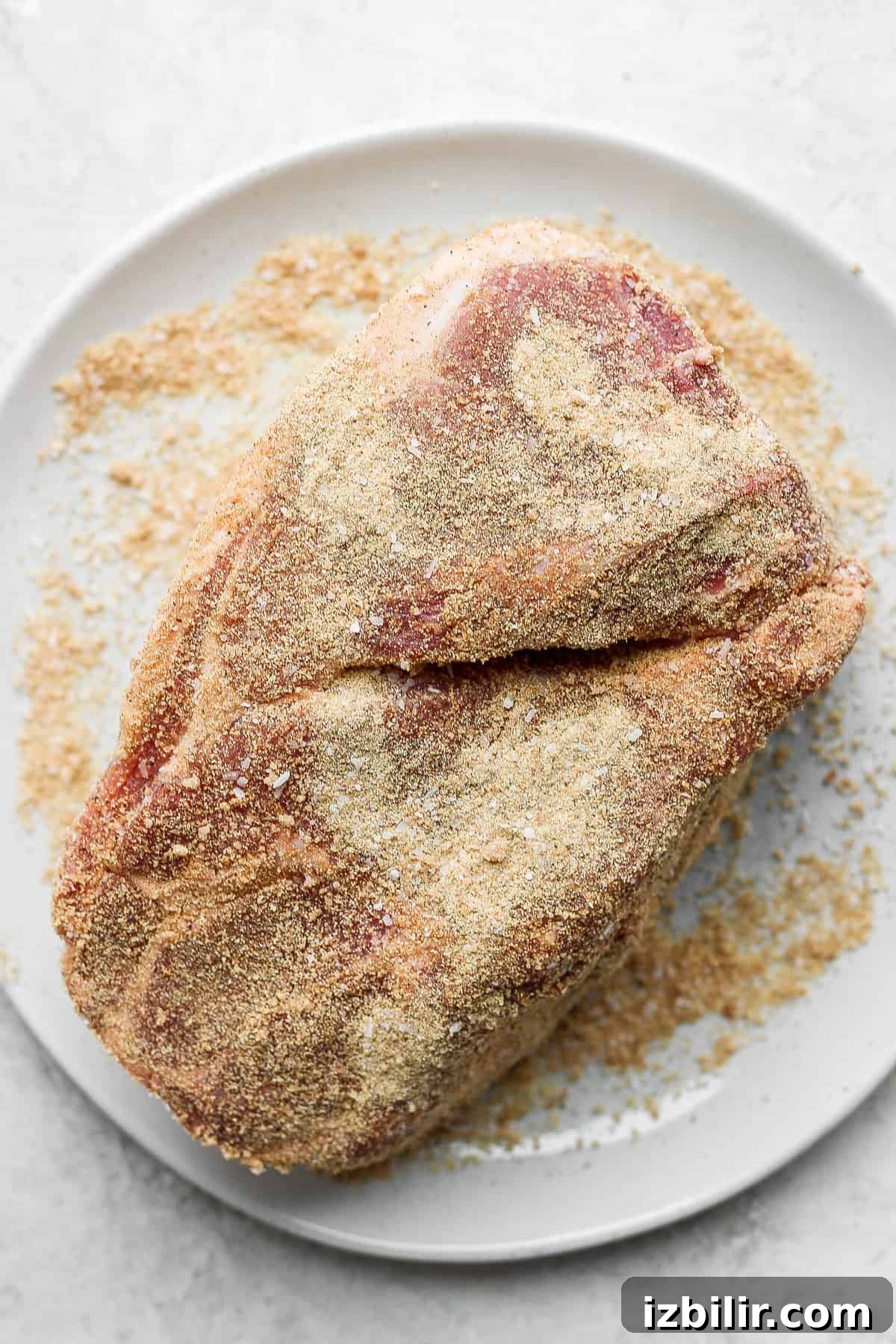 Slow-Roasted Pork Shoulder Recipe for Tender Pulled Pork 5 seasoned pork on plate.