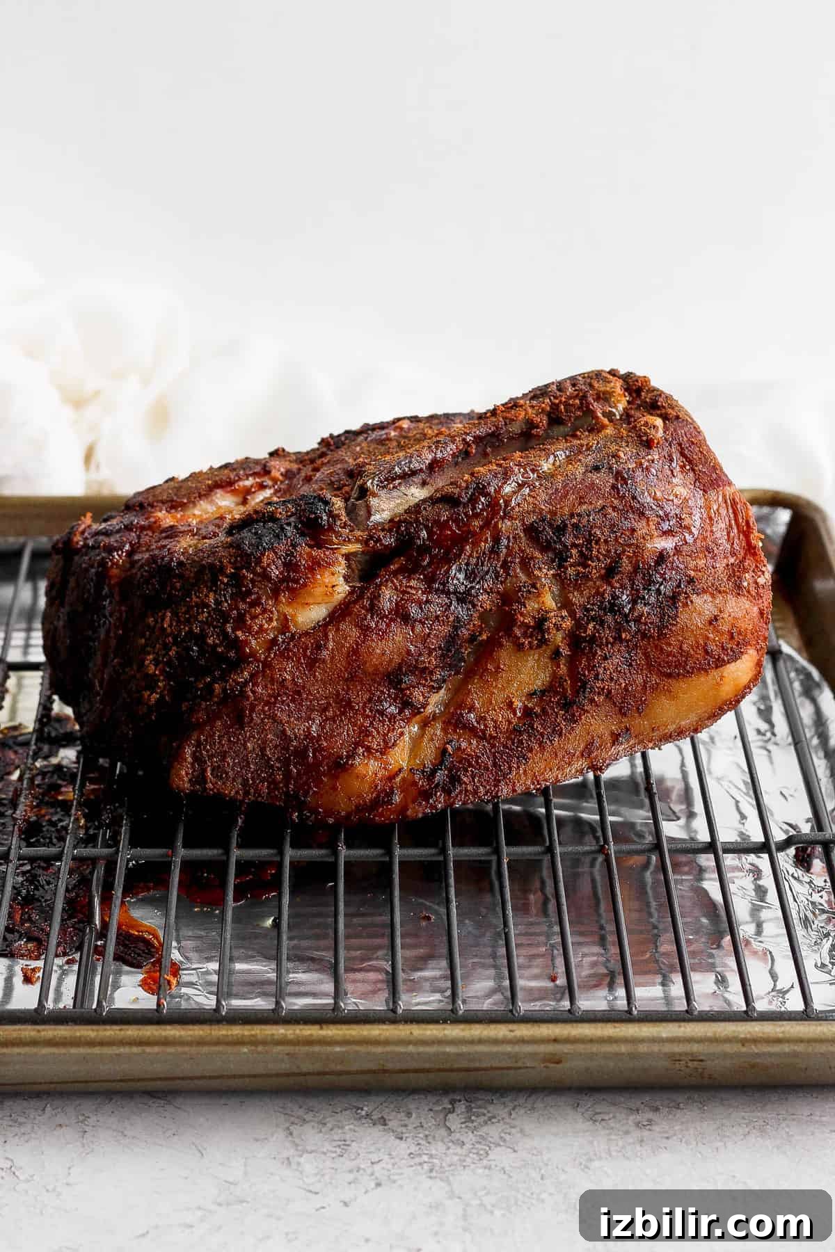 Slow-Roasted Pork Shoulder Recipe for Tender Pulled Pork 7 slow cooked pork on wire rack.