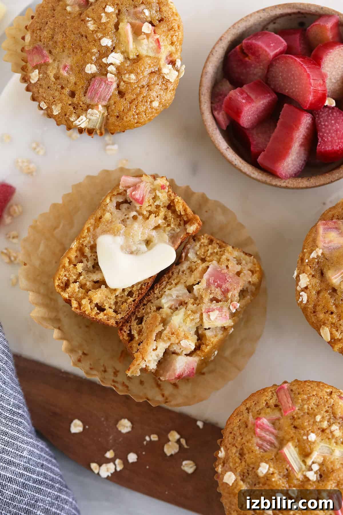 Lemon-Glazed Rhubarb Muffins 8 A rhubarb muffin with a pad of butter.