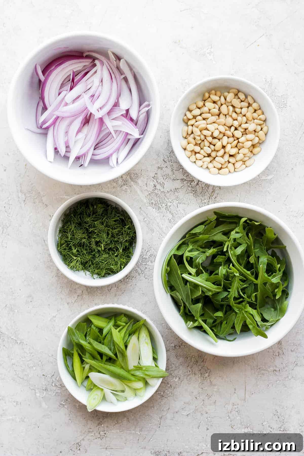 Zucchini salad ingredients in bowls, ready to be tossed together zucchini salad ingredients in bowls, ready to be tossed together