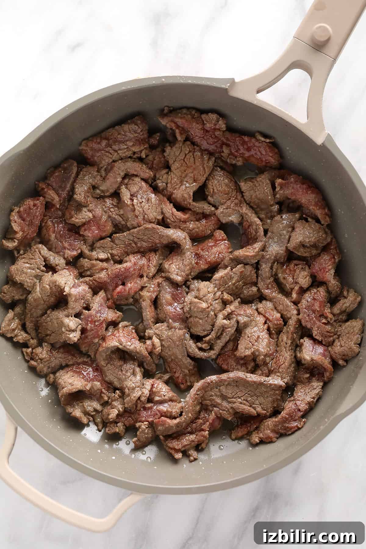Beef slices in a pan.