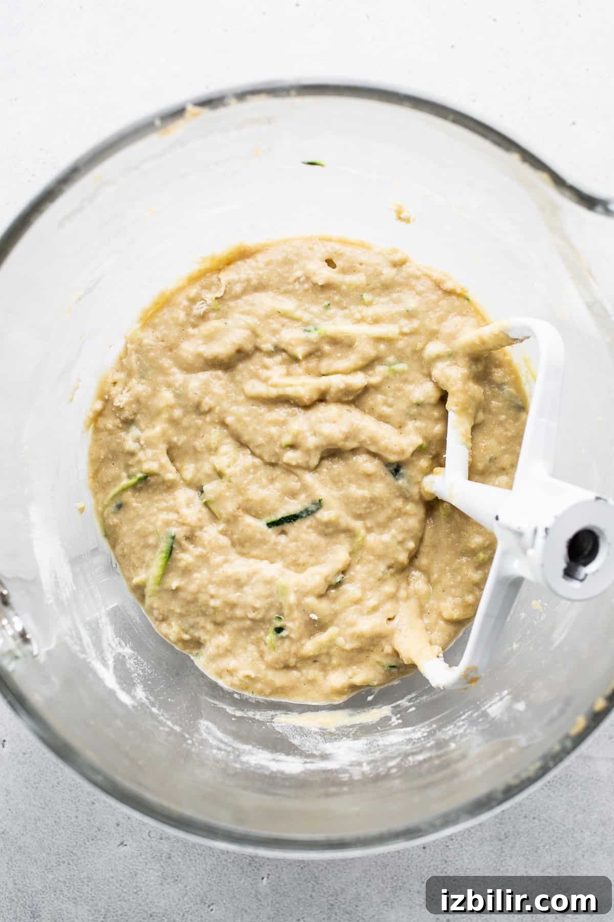 Moist Zucchini Bread with Cinnamon and Walnuts 4 A food processor with a mixture in it.