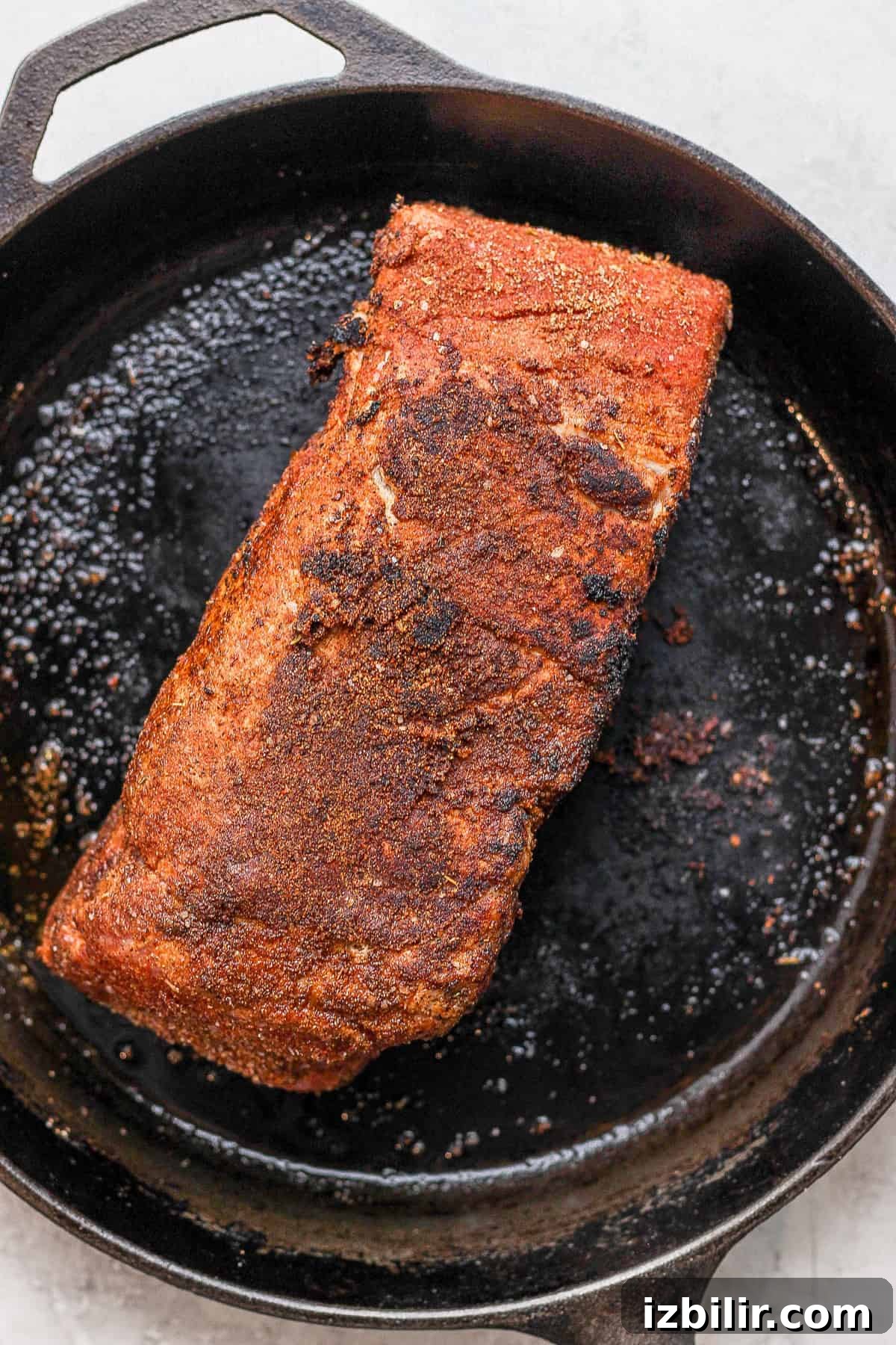 How to Make Crispy Carnitas Tacos 4 Pork shoulder being seared in a cast iron.