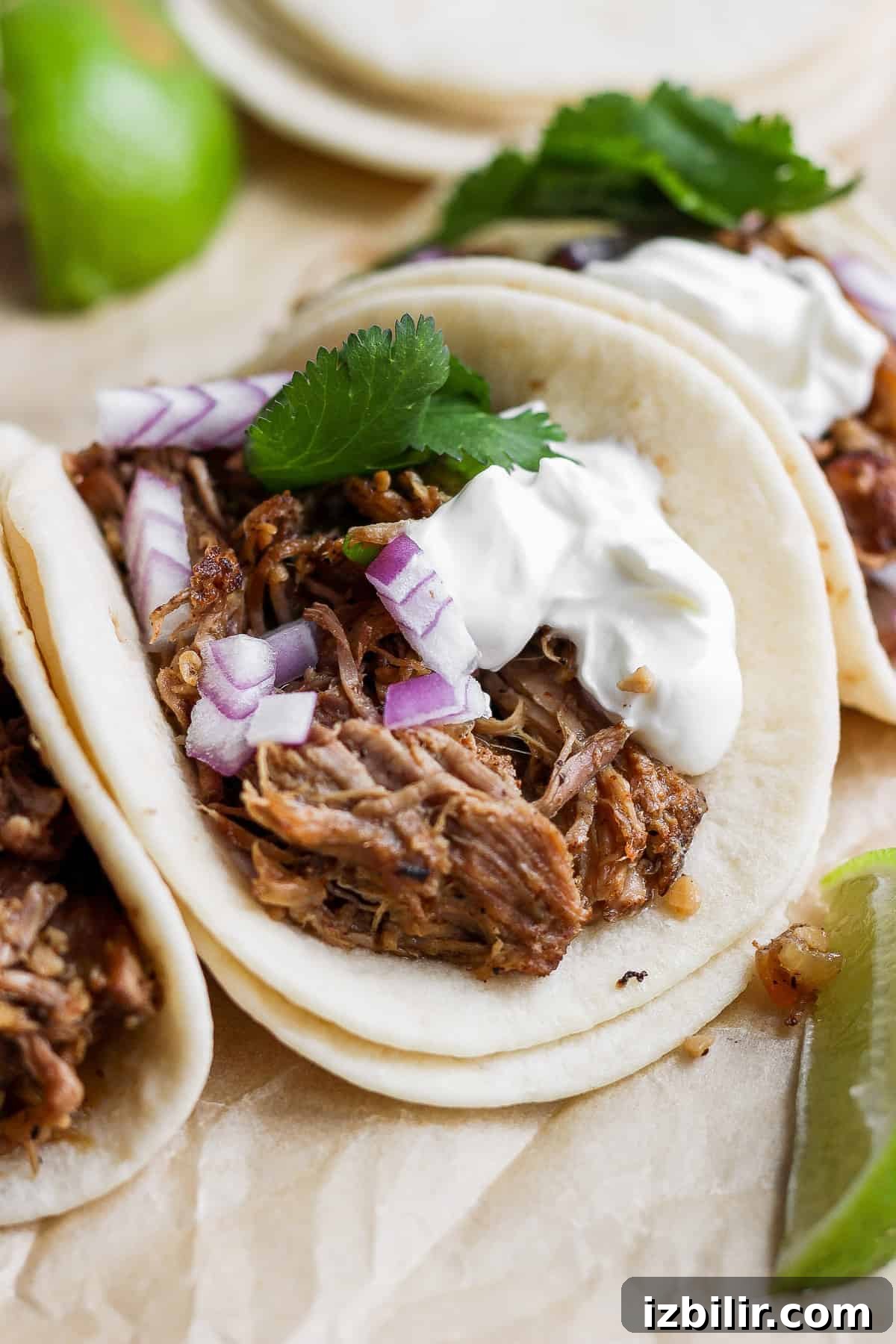 How to Make Crispy Carnitas Tacos 7 Carnitas tacos on a plate.