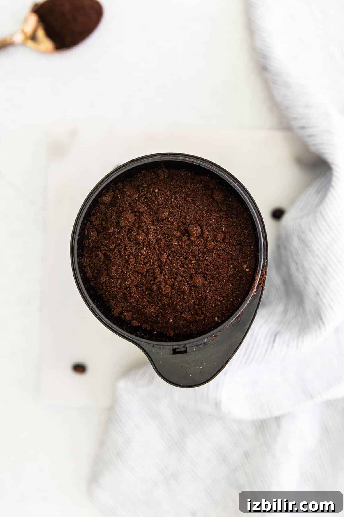 Cold Brew Coffee Recipe: Brew Smooth Coffee at Home 5 Coffee grounds in a coffee grinder.