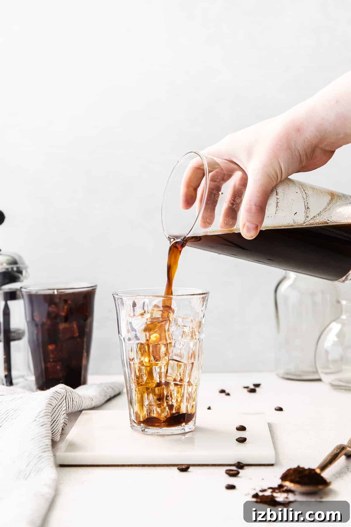 Cold Brew Coffee Recipe: Brew Smooth Coffee at Home 8 Pouring cold brew coffee into a glass