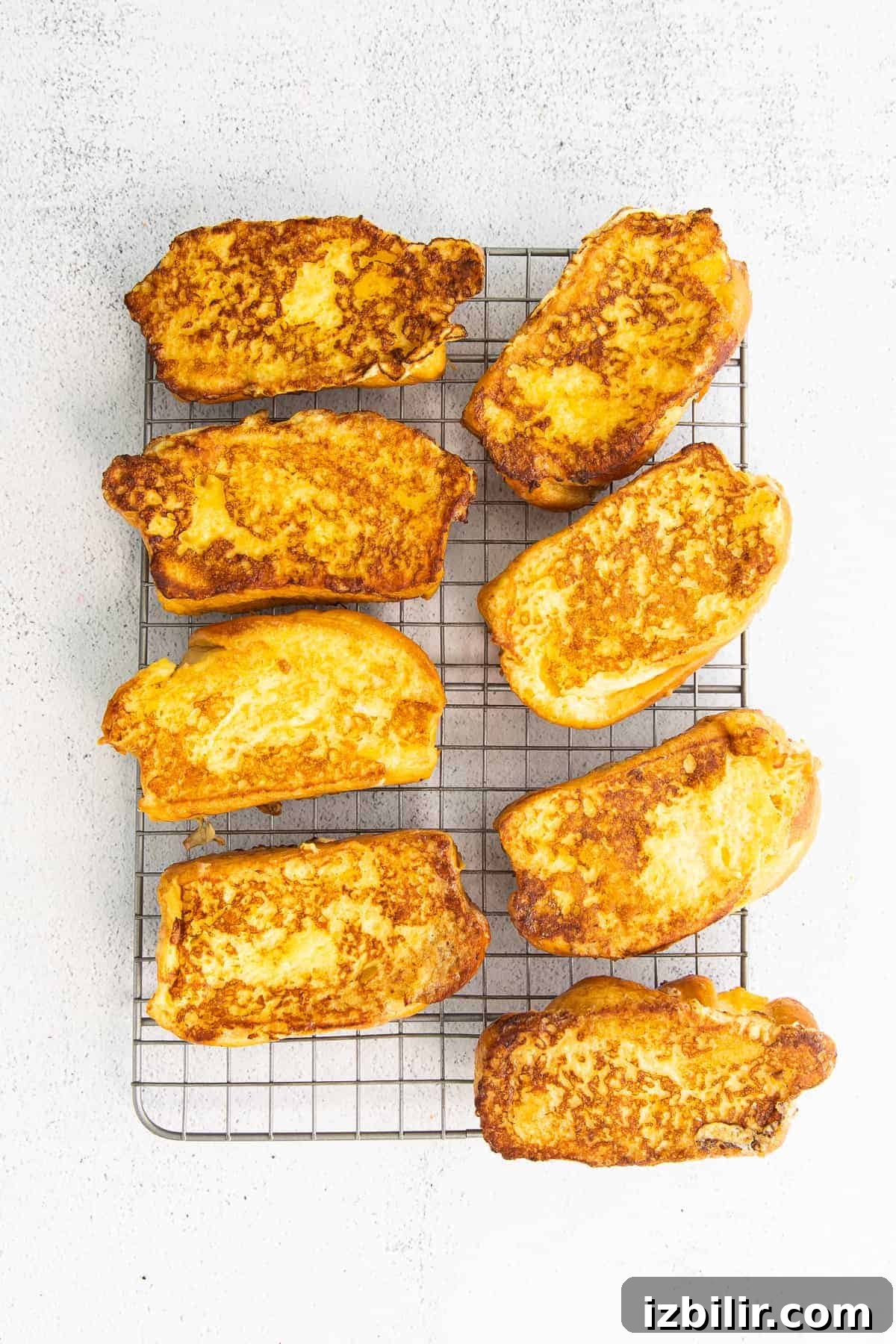 cooked french toast on a cooling rack and ready to be served