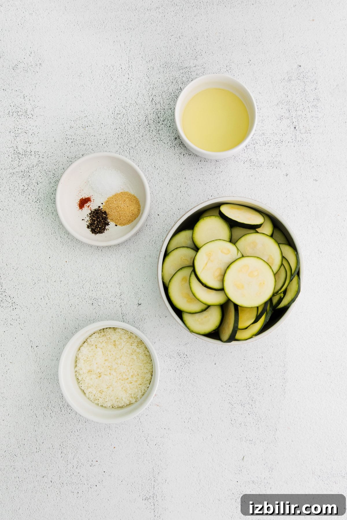 Parmesan Baked Zucchini Recipe 3 All the ingredients for baked zucchini in small bowls.