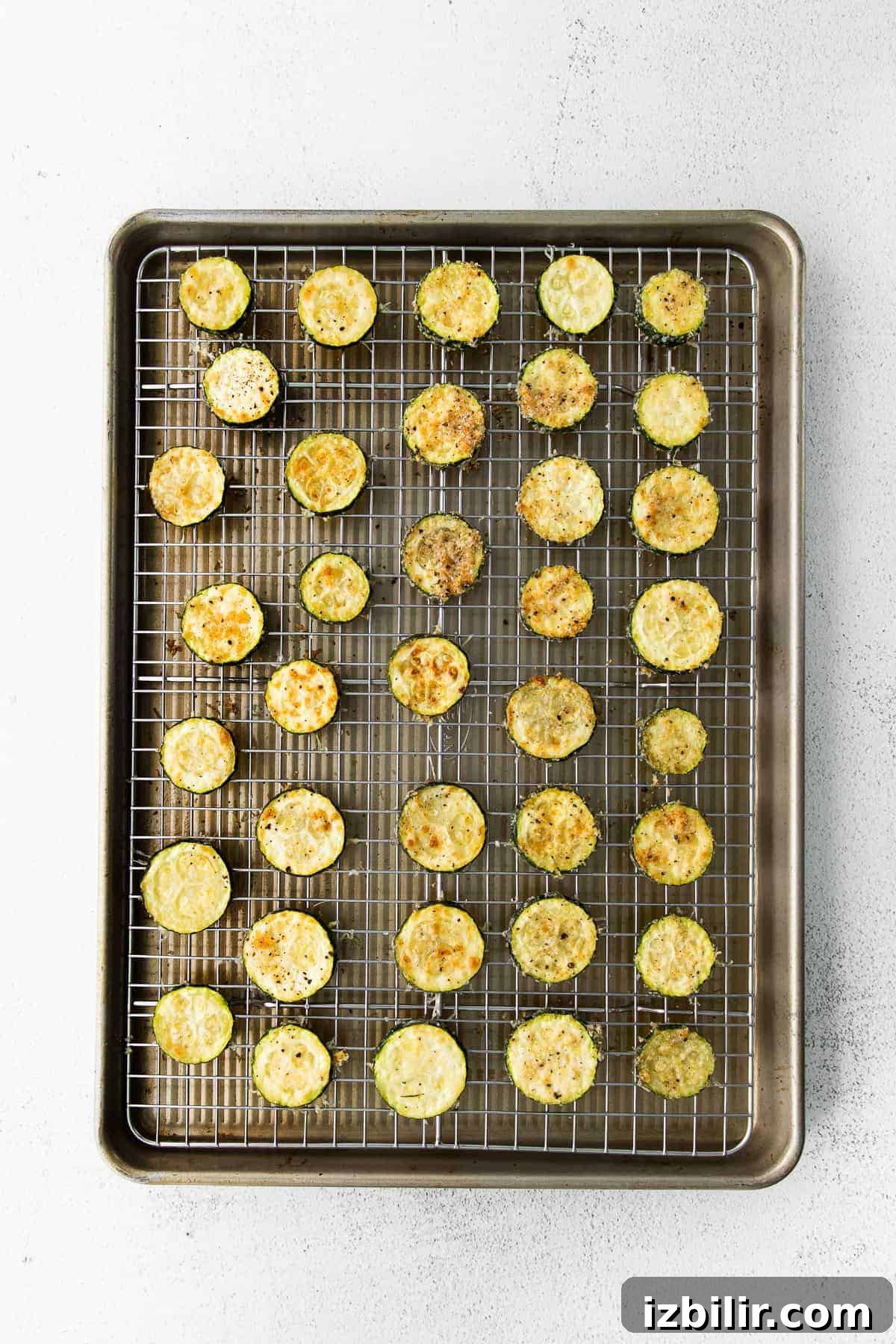 Parmesan Baked Zucchini Recipe 4 Baked Zucchini on a baking sheet.