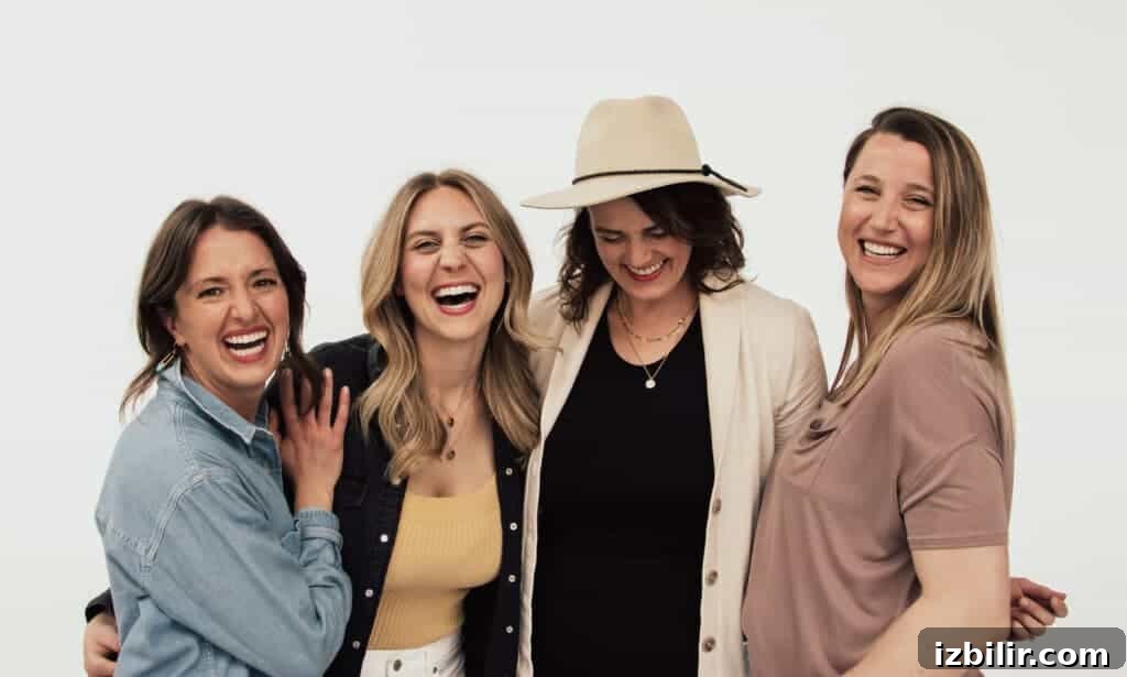 Four women wearing necklaces.