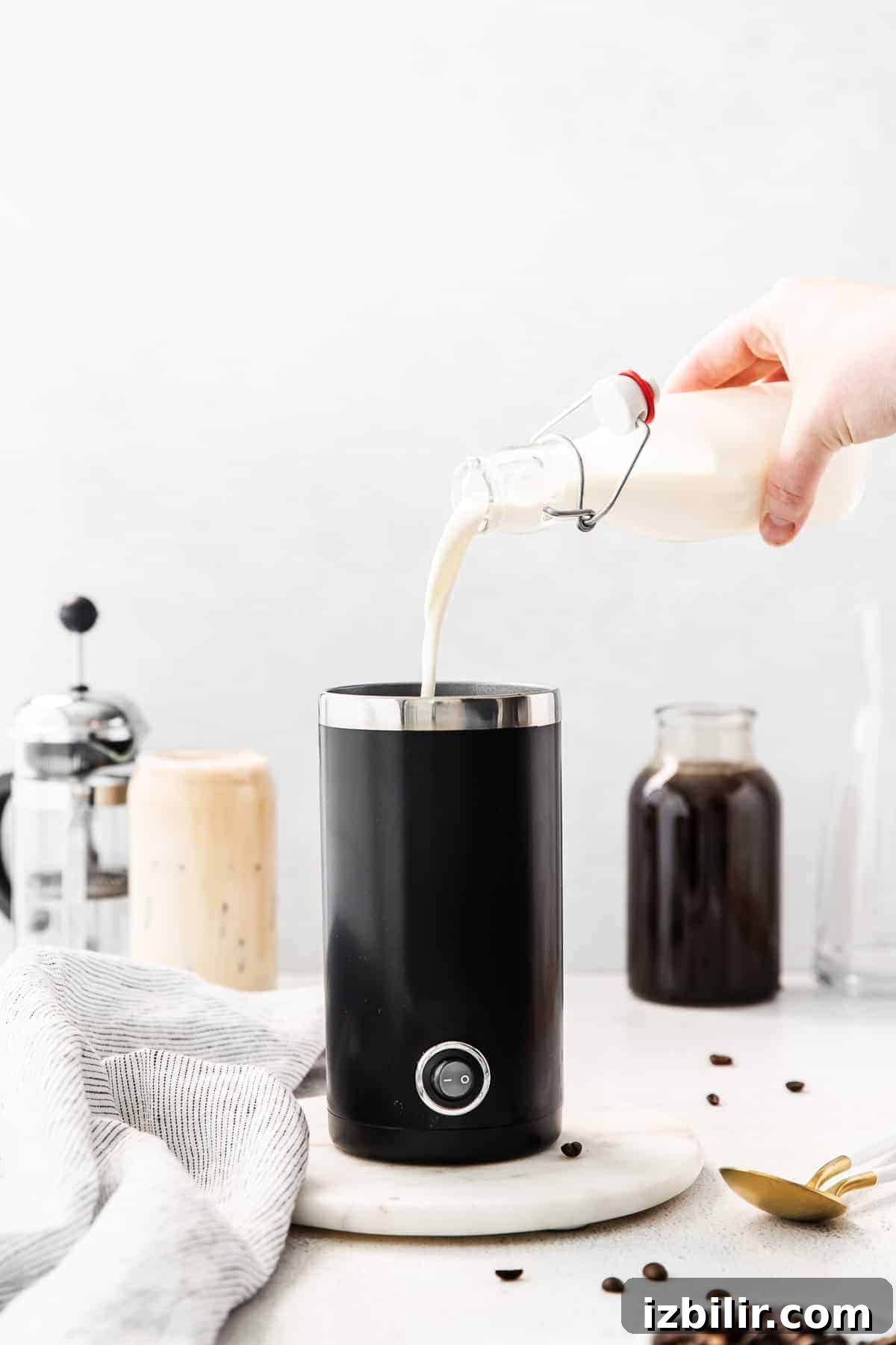 Pouring vanilla sweet cream into frother