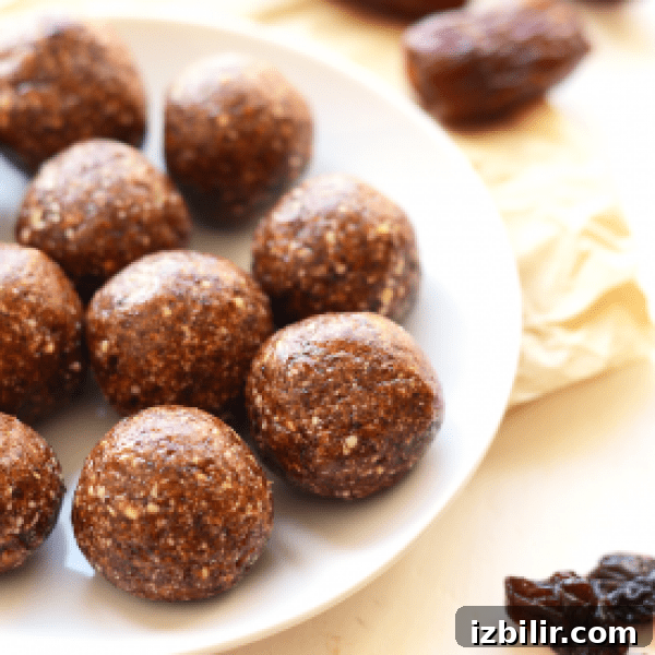Chocolate energy balls on a white plate.