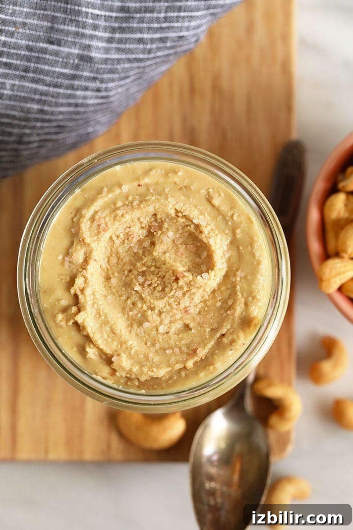 Homemade cashew butter ready to enjoy cashew butter stirred in a jar ready to be eaten