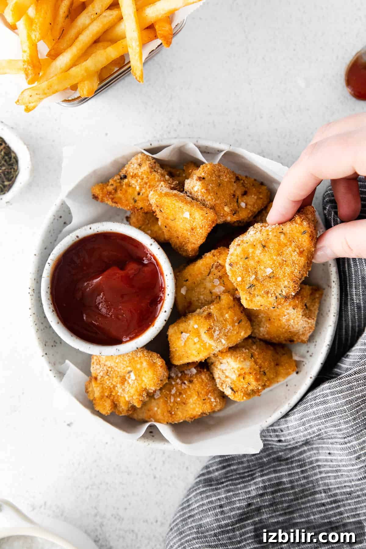 Air fryer chicken nuggets with BBQ sauce.