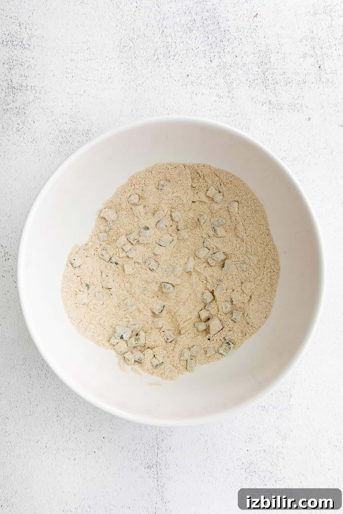 A bowl of corn fritter ingredients. 