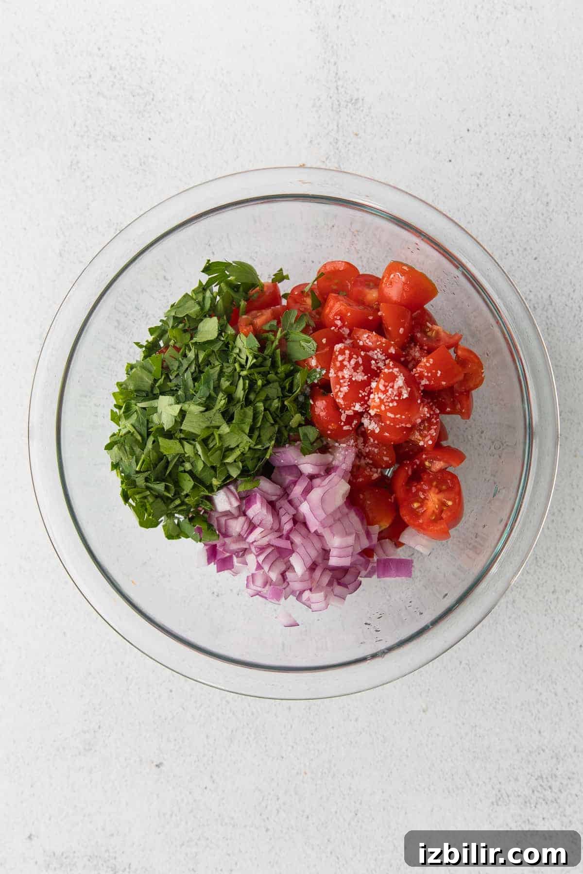 Tomato pico ingredients ingredients for tomato pico in a bowl, ready to be mixed together