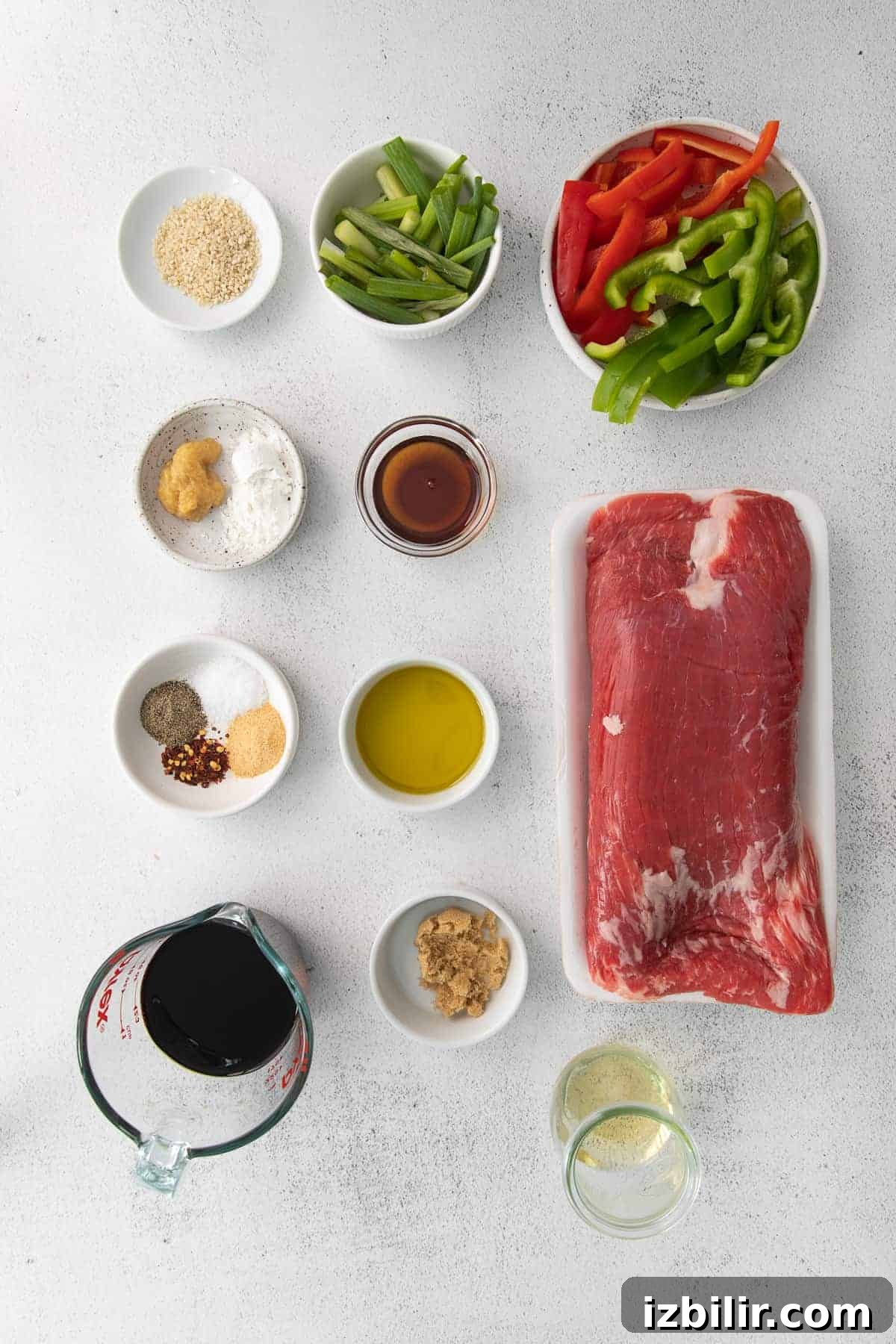 Pepper Steak Recipe: Tender Beef with Bell Peppers 4 all the ingredients for pepper steak in small bowls.