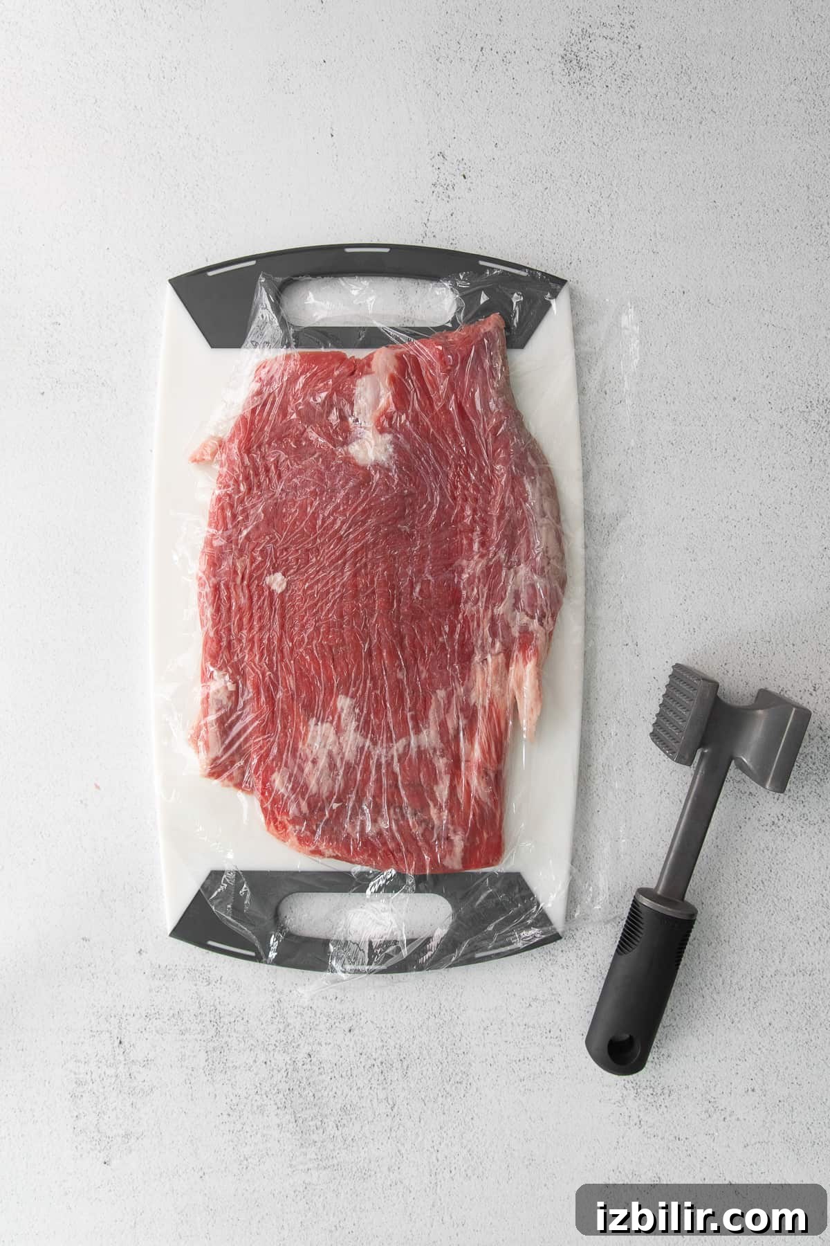 Pepper Steak Recipe: Tender Beef with Bell Peppers 5 Flank steak with a meat tenderizer.