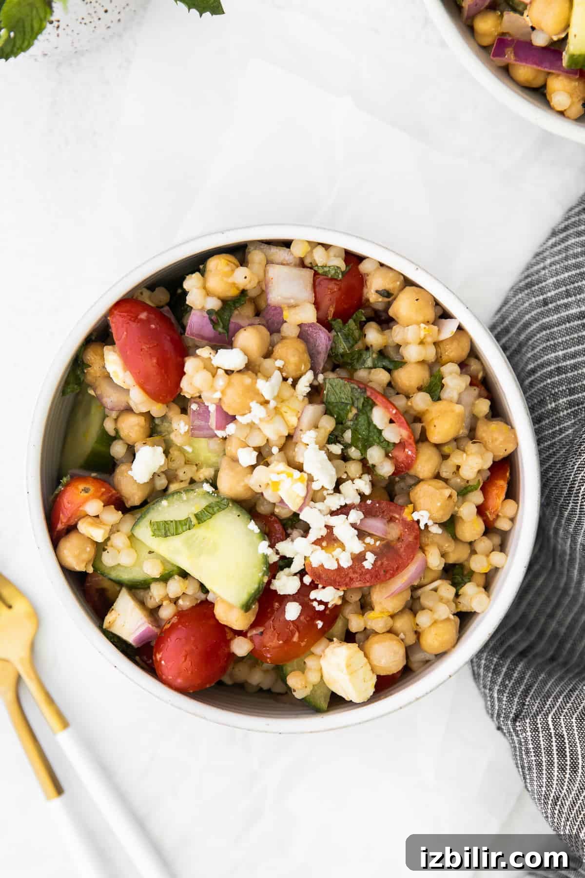 individual serving of mediterranean couscous salad in a bowl