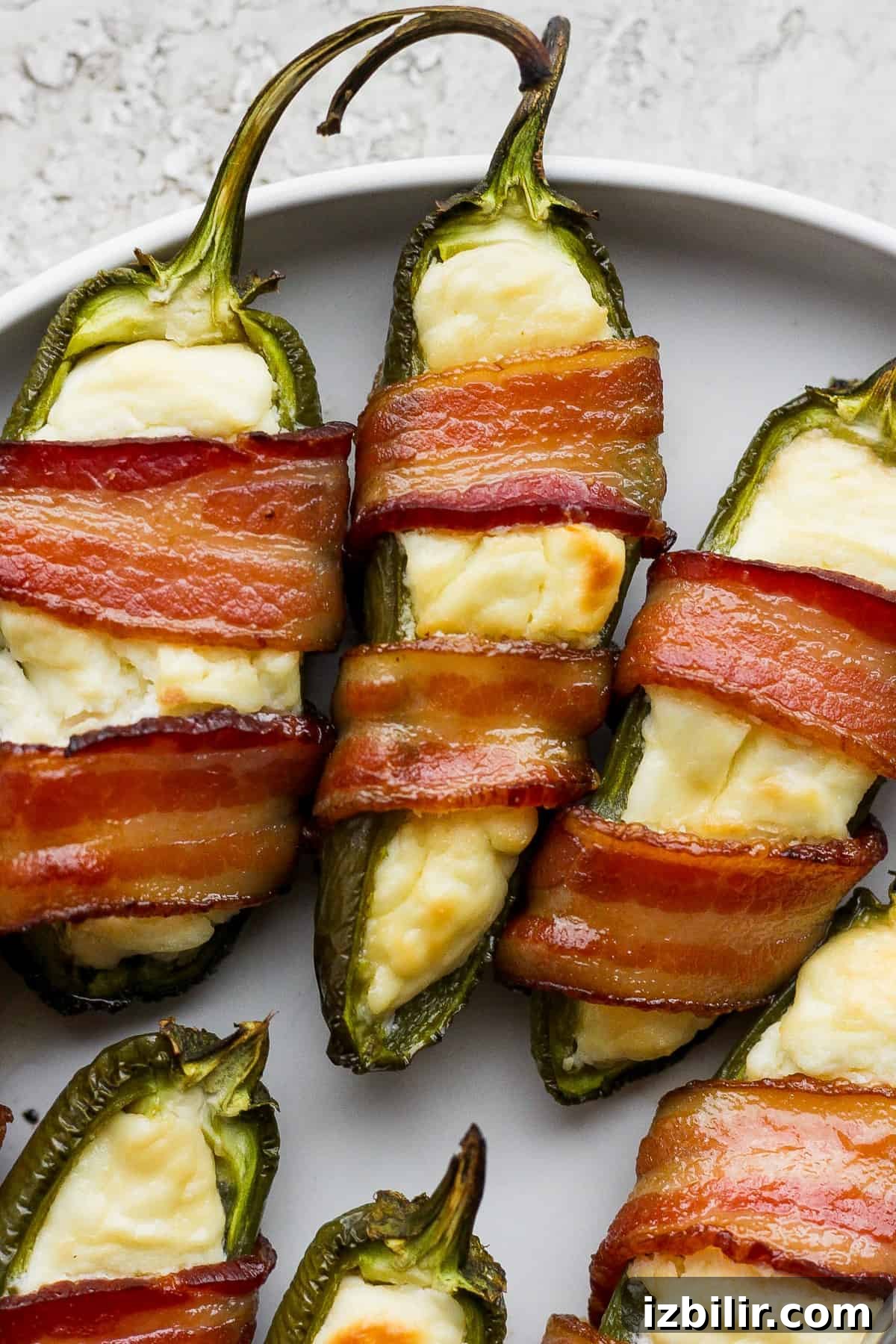 Jalapeno poppers served on a plate.