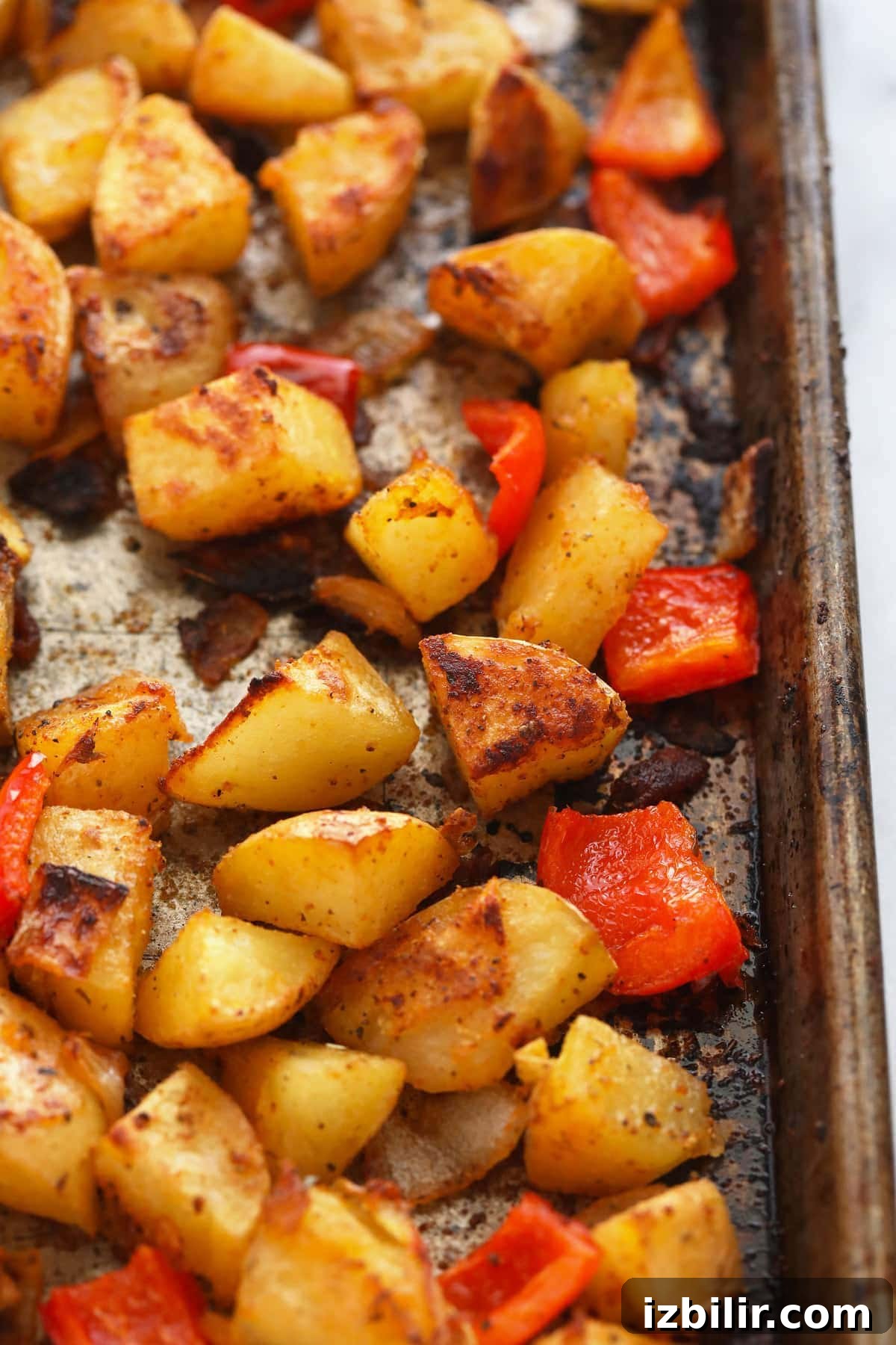 breakfast potatoes on a baking sheet looking crispy and delicious