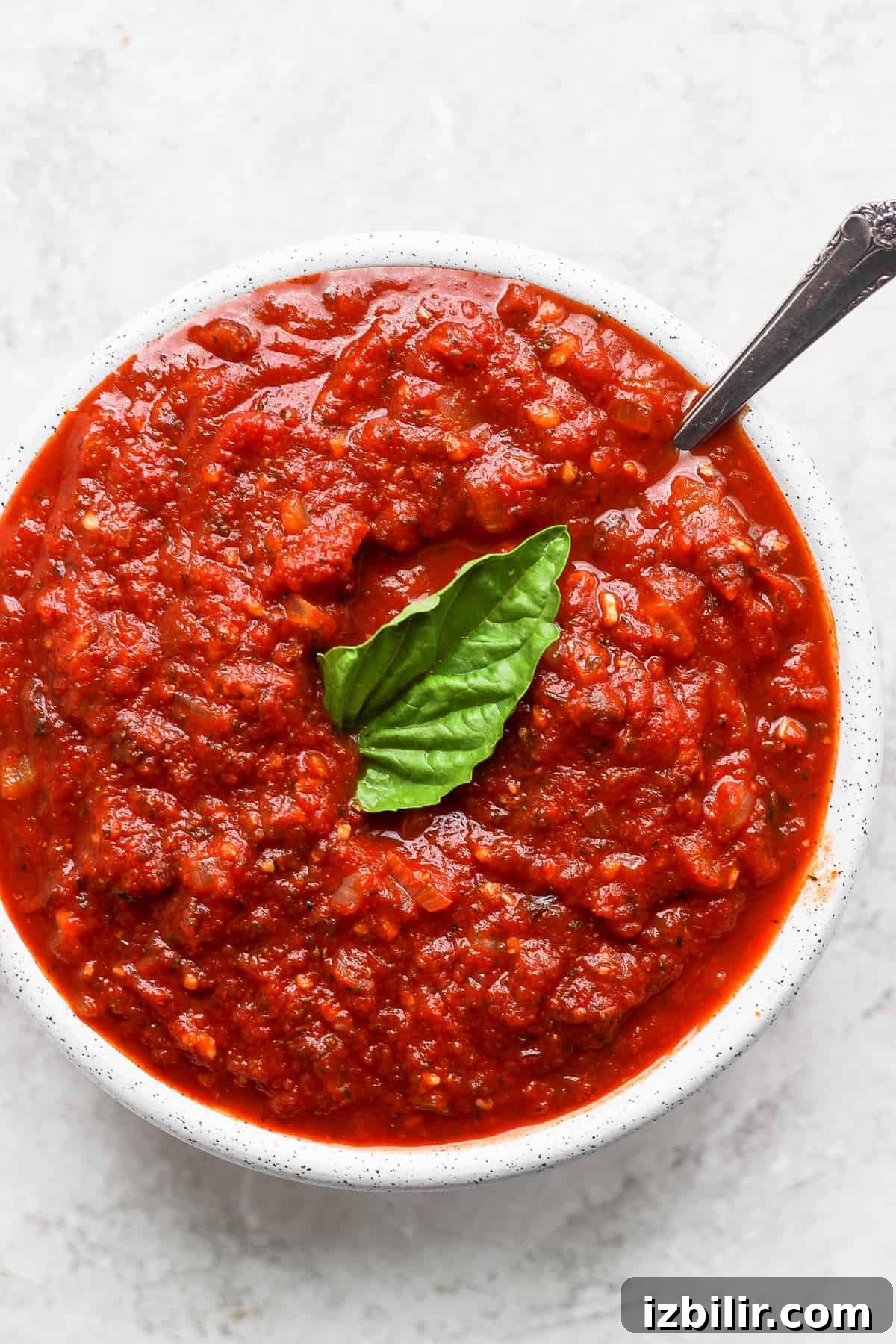 marinara sauce in bowl with spoon