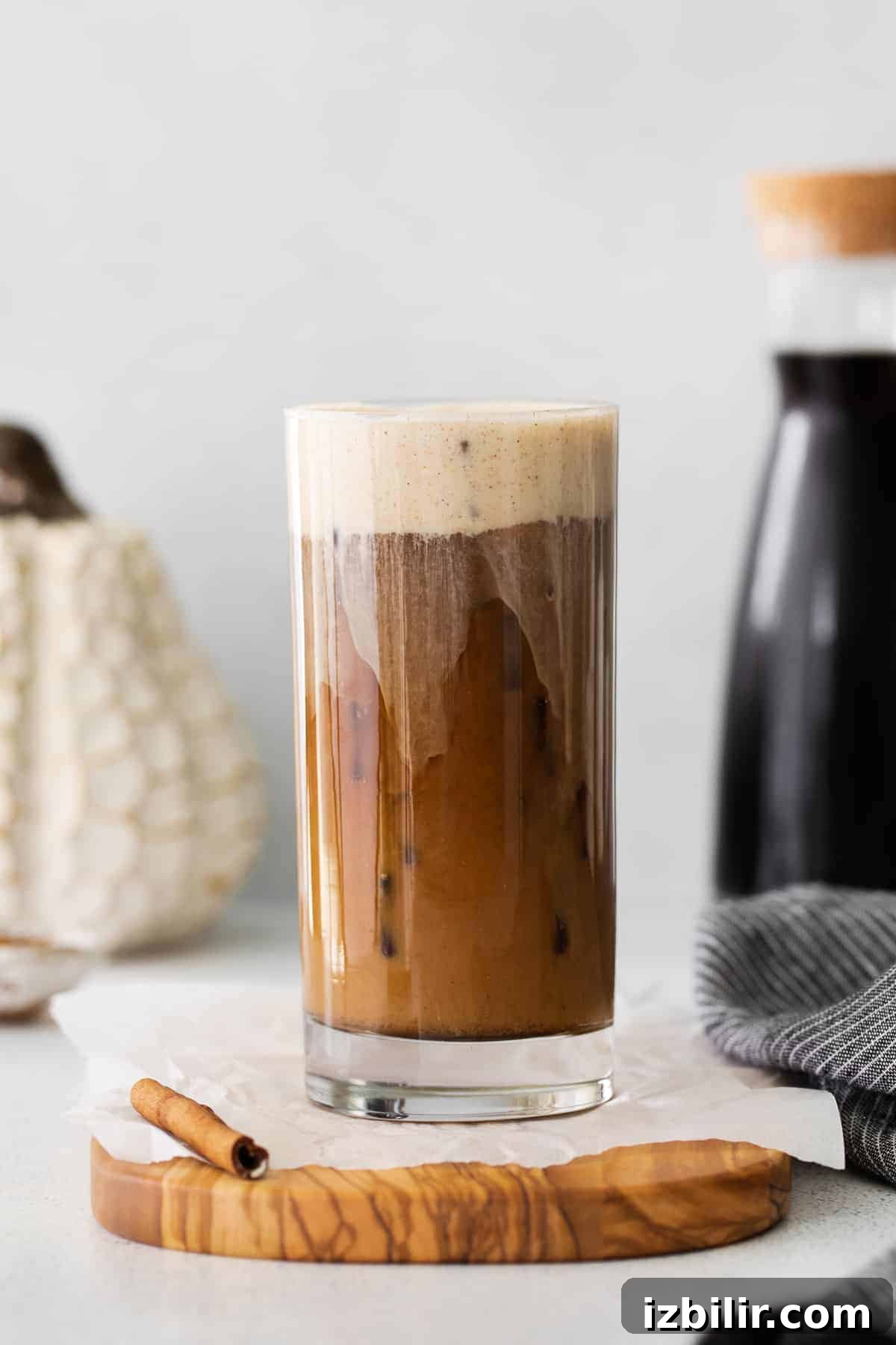 Pumpkin Cream Cold Brew in a glass poured over ice.