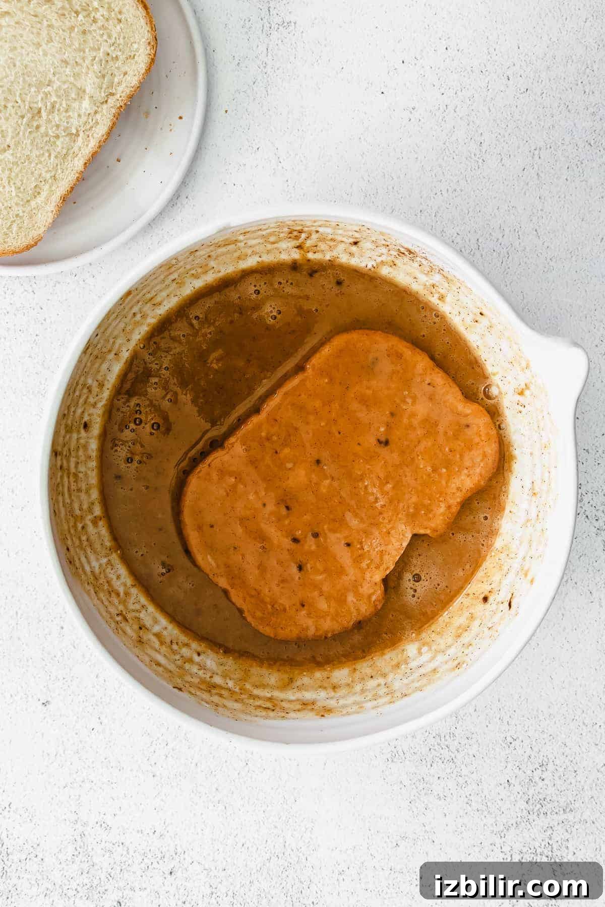 Fluffy Pumpkin French Toast Recipe with Maple Cinnamon Syrup 5 french toast in pumpkin mixture