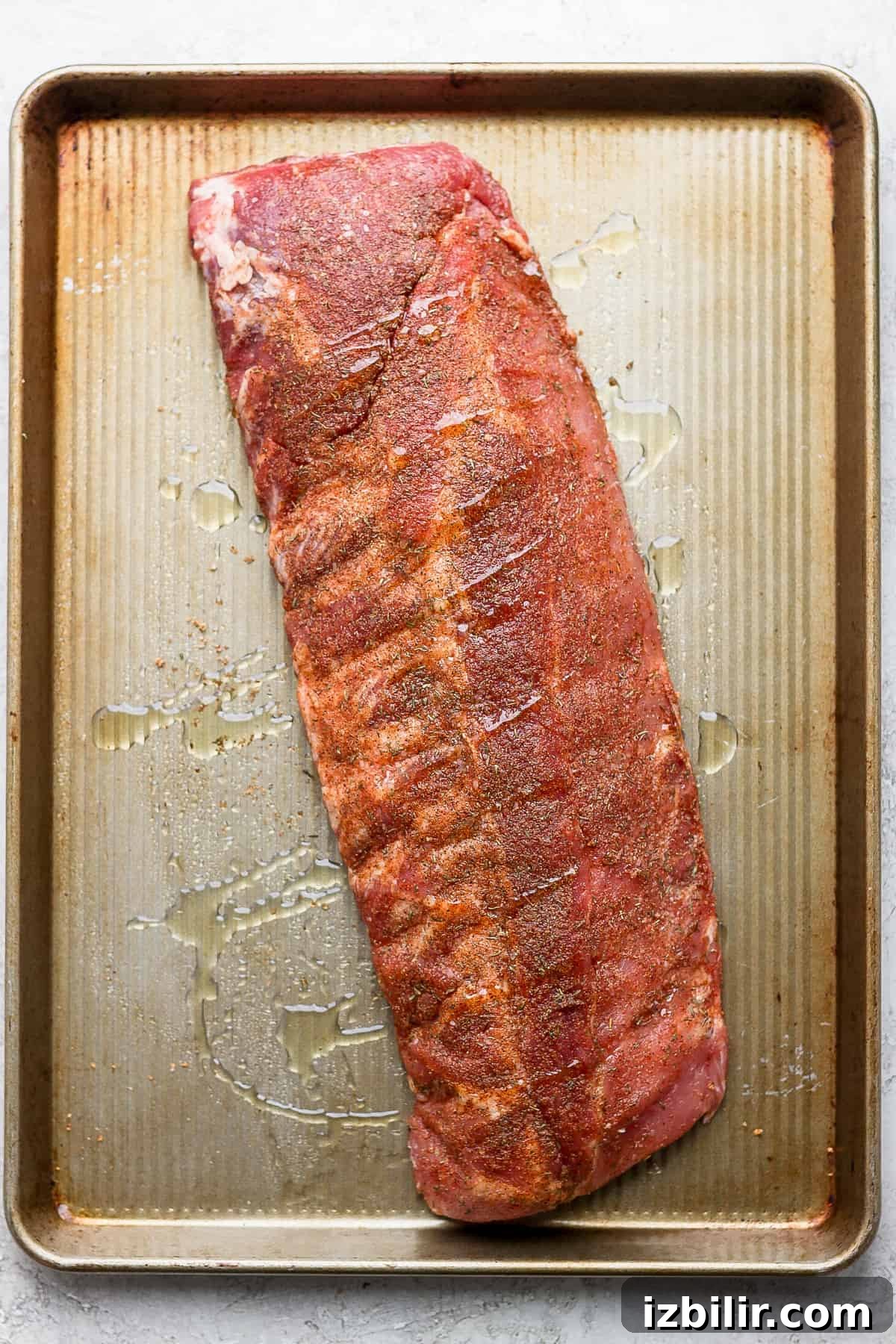 How to Make Fall-Off-the-Bone Oven Ribs 7 A rack of ribs drizzled in oil
