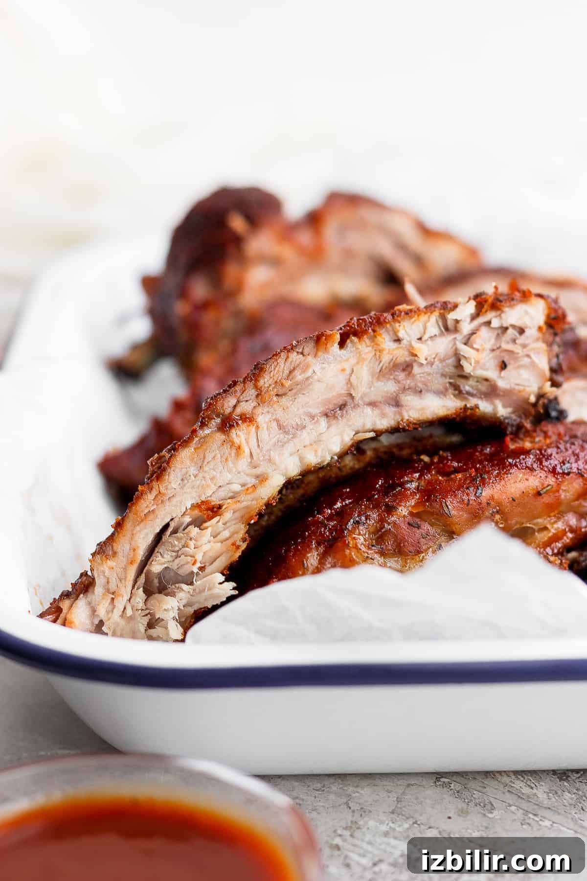 How to Make Fall-Off-the-Bone Oven Ribs 9 Finished baked ribs in a baking pan