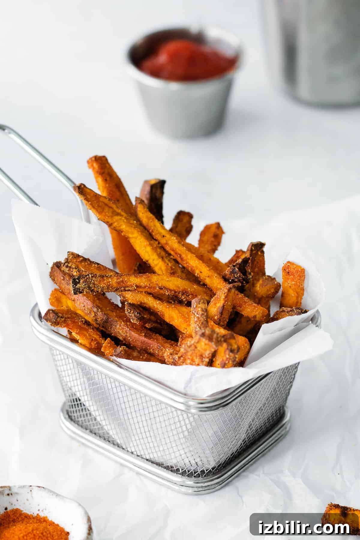 air fryer sweet potato fries in a fry basket