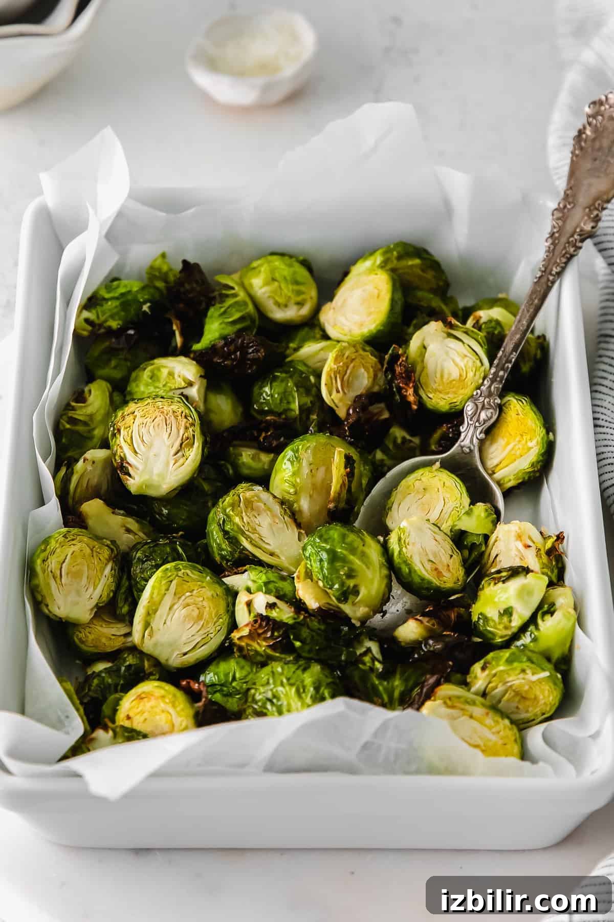 Crispy Air Fryer Brussels Sprouts Recipe 6 Air fryer brussel sprouts in a casserole dish.