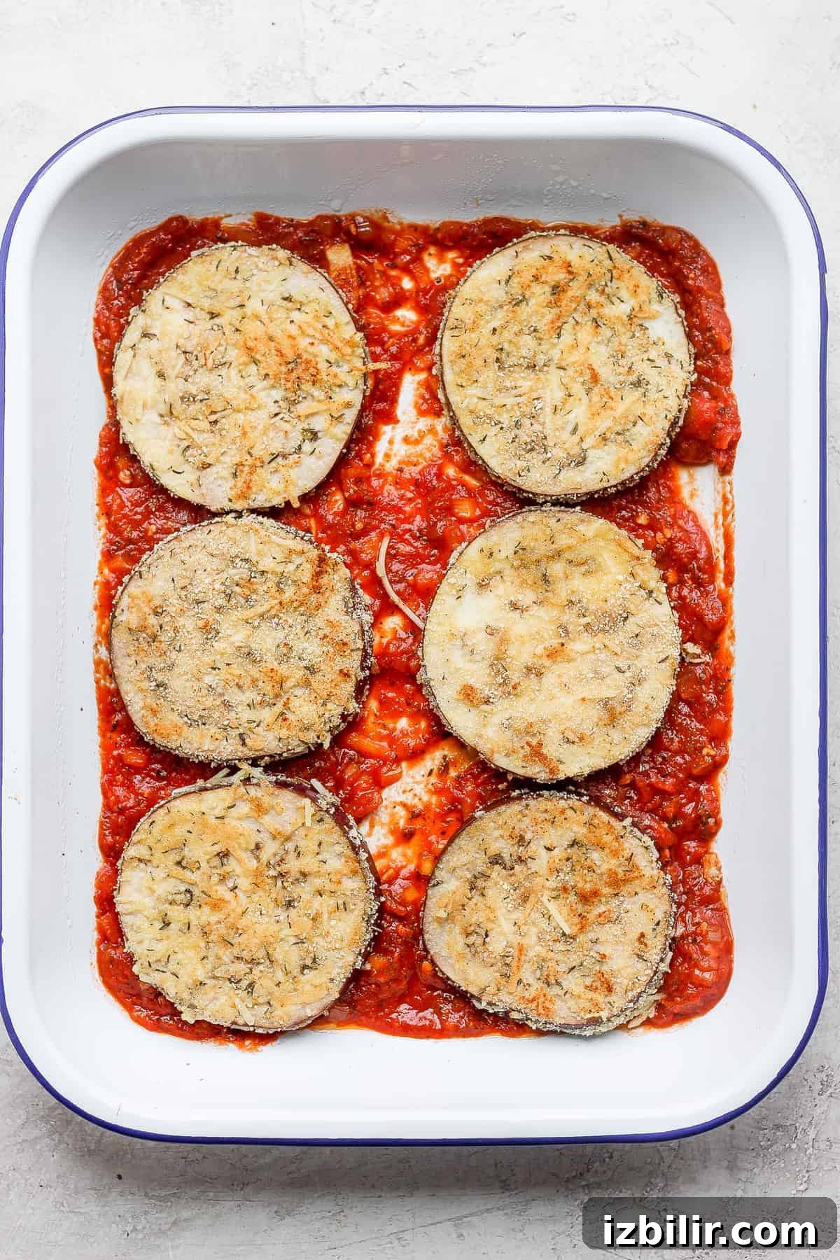 Crispy Baked Eggplant Parmesan Recipe 8 Eggplant parmesan in a baking dish.