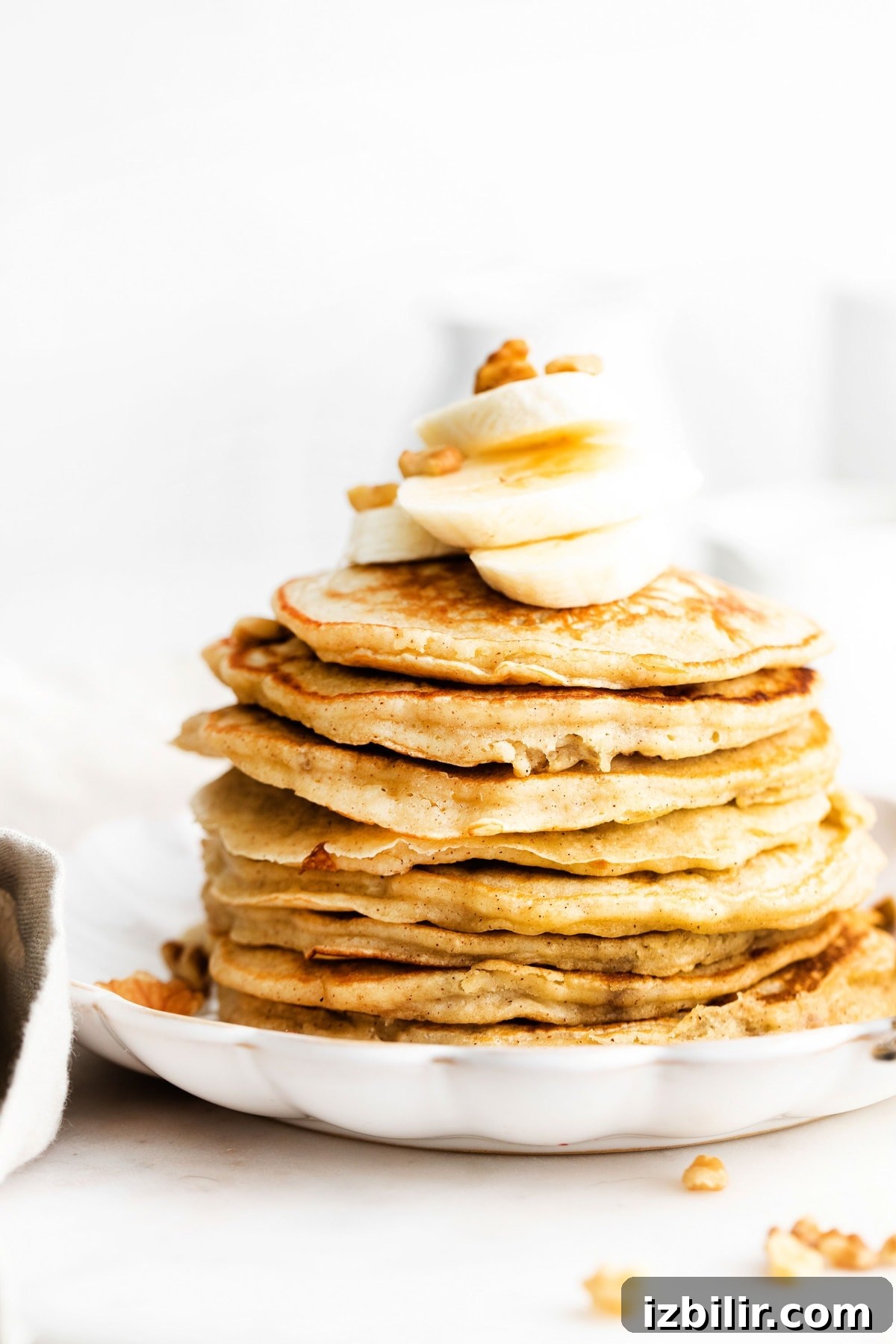 stack of pancakes with banana on top