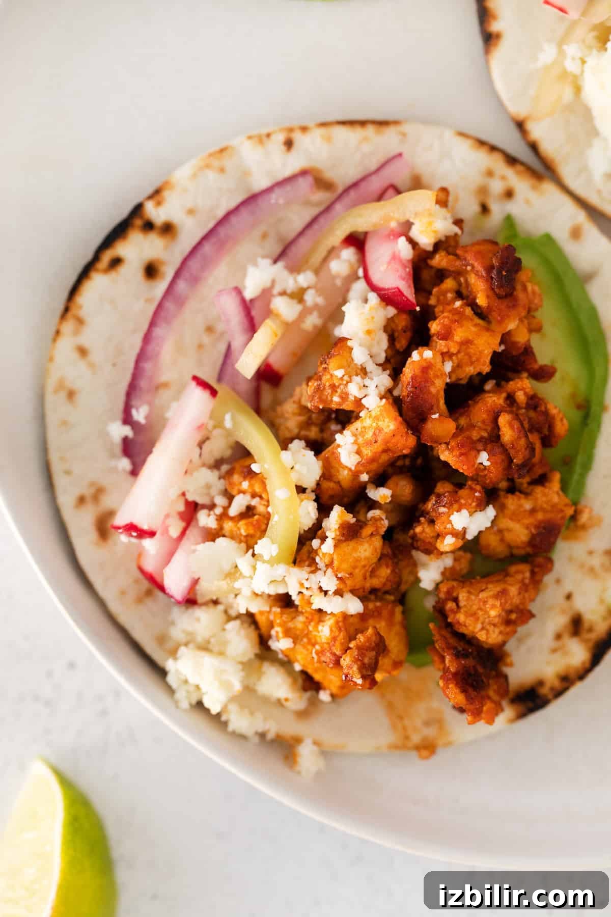 Tofu tacos in a flour tortilla.
