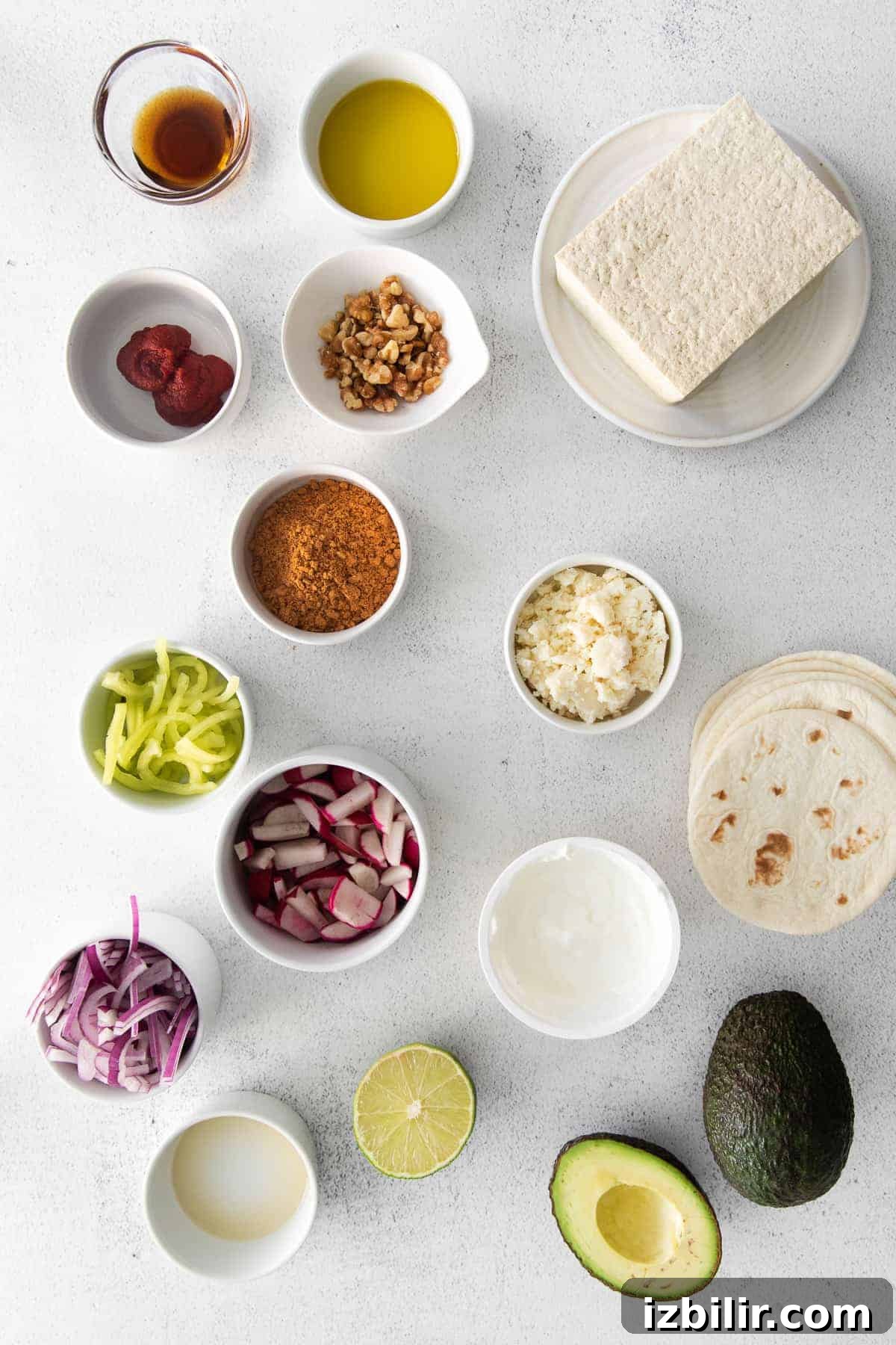 All the ingredients for tofu tacos in small dishes.