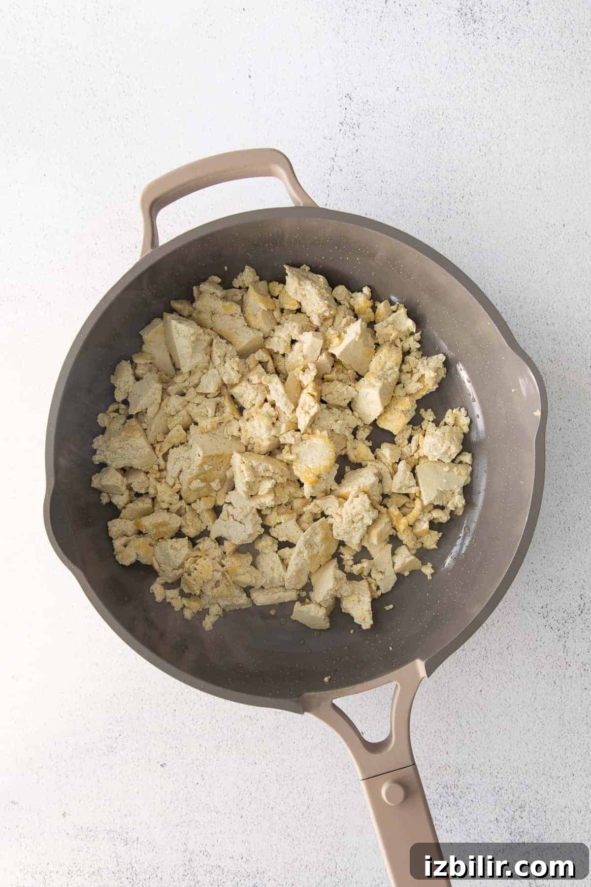 Crumbled tofu in a pan.