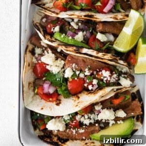 Mexican steak tacos seasoned and baked in a dish.