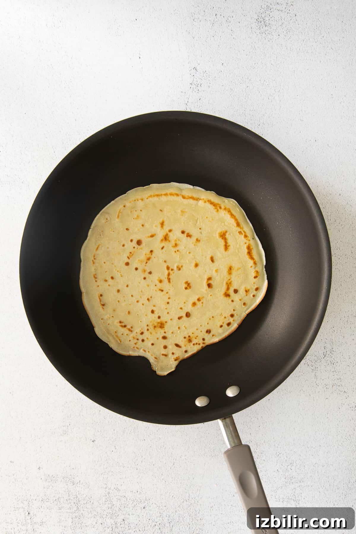 A crepe in a nonstick pan.