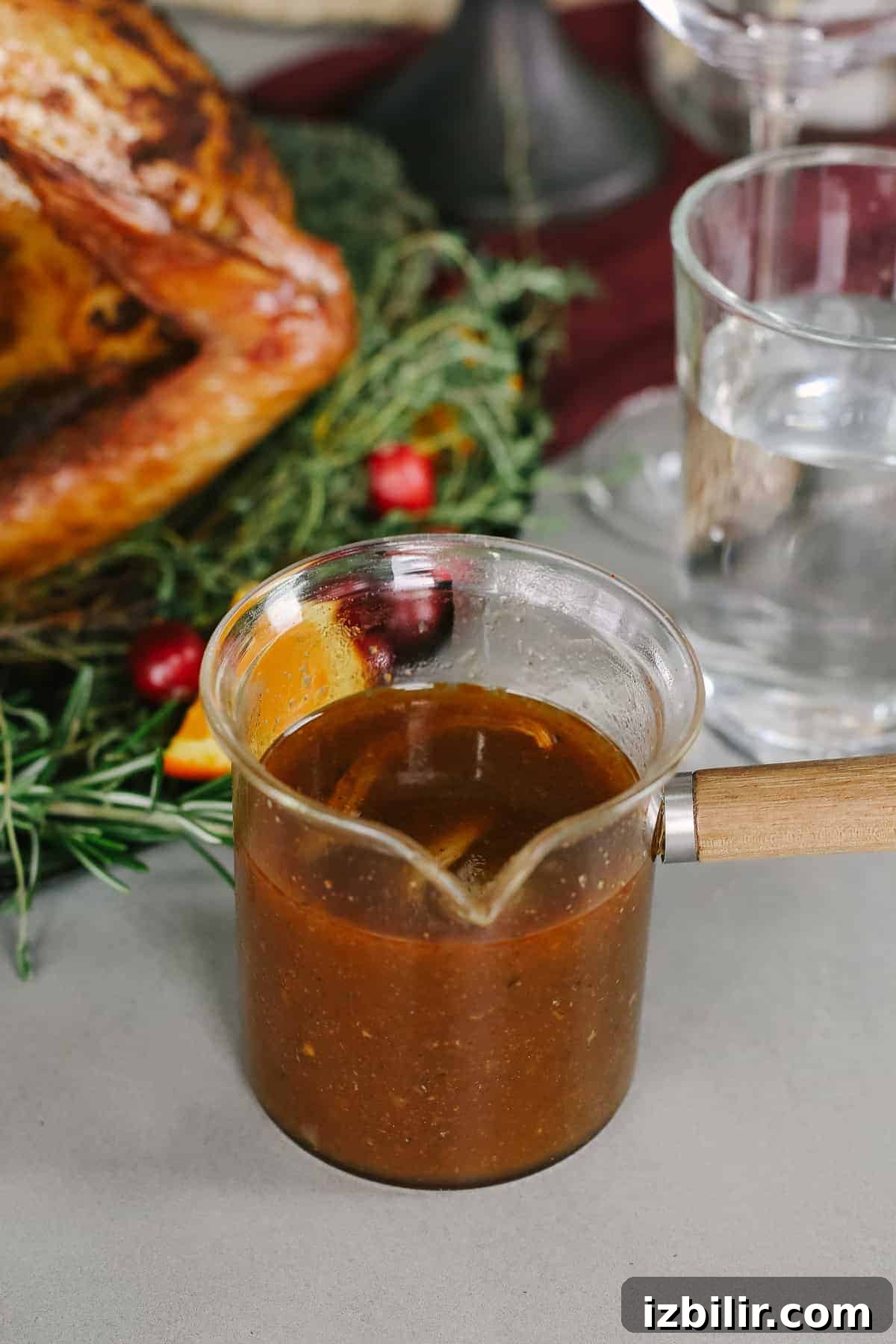 Smoked turkey gravy in a glass jar.