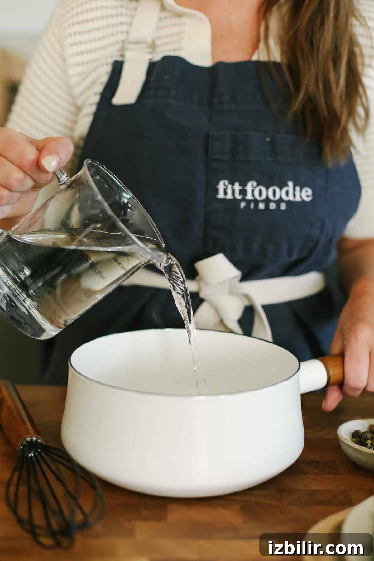 Adding water and salt to a small saucepan.