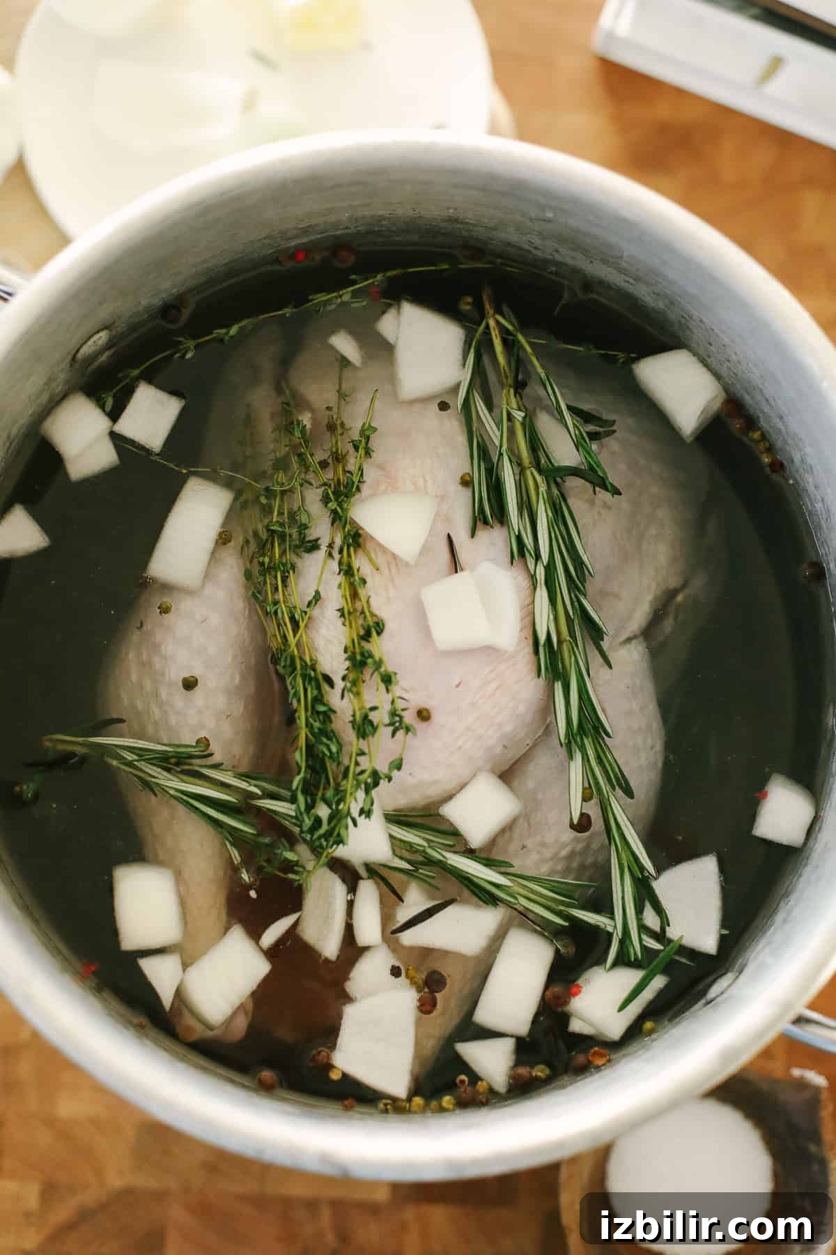 A turkey in a large pot.