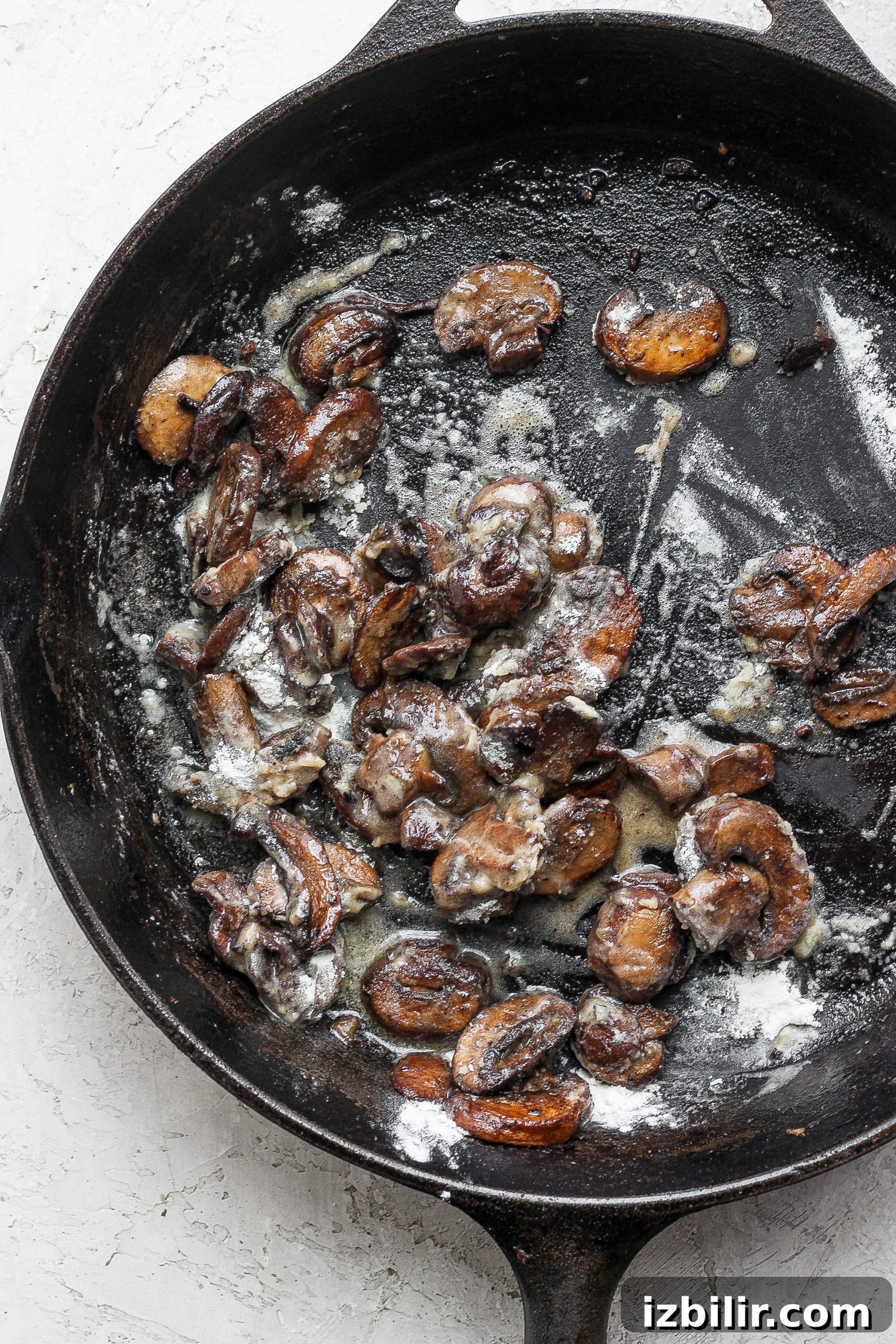 Sautéed mushrooms sauteed mushrooms in a cast iron skillet for ground beef stroganoff