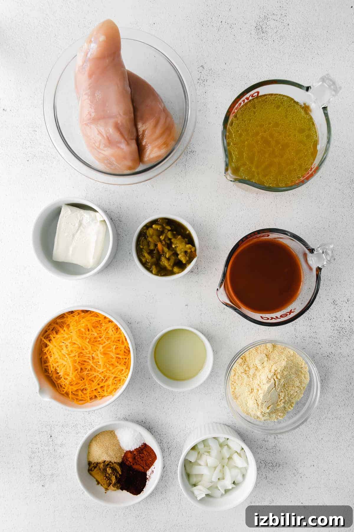 All the ingredients for Chilis Chicken Enchilada Soup in small bowls.
