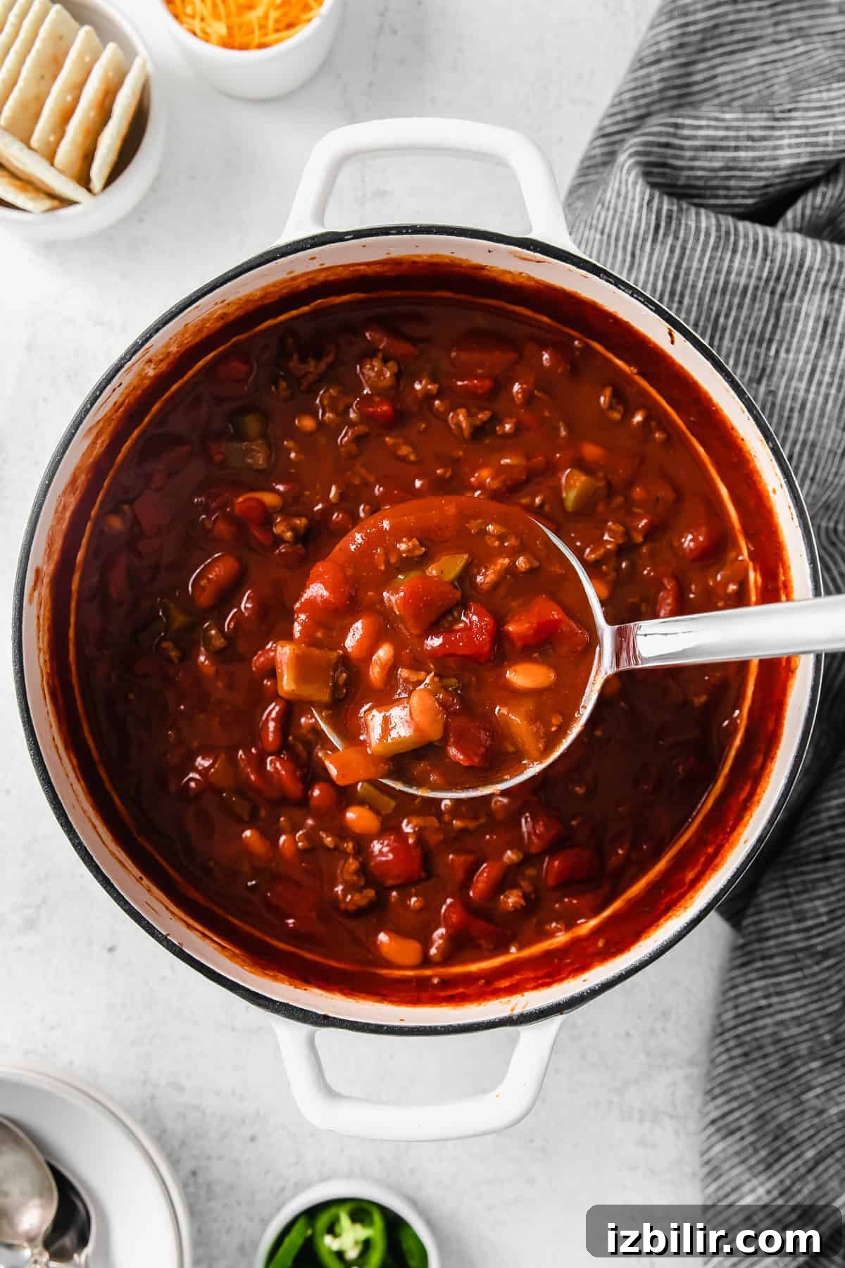 Bowl of chili ready to serve Bowl of chili with crackers and spoon