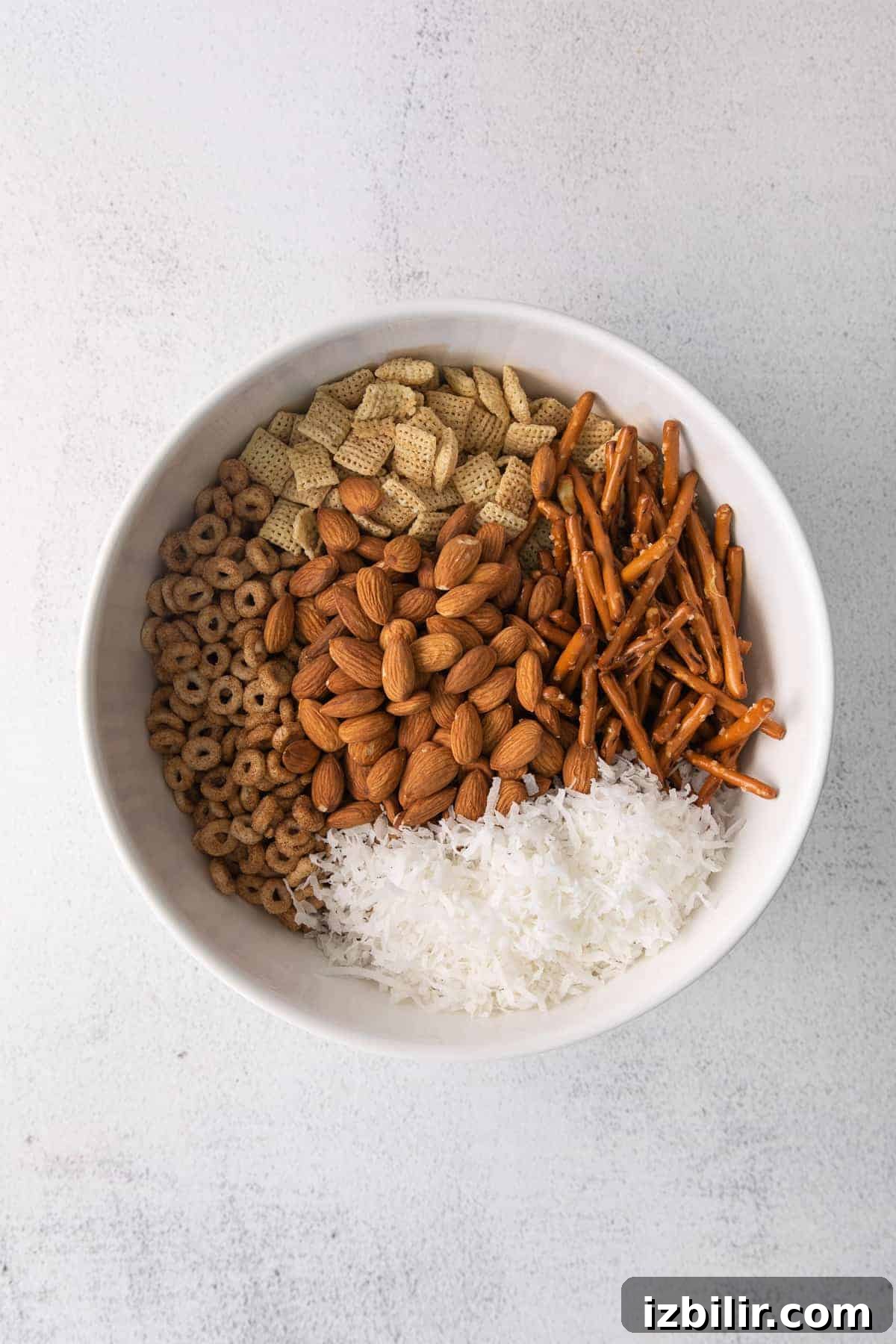 Ingredients for chai chex mix in a bowl.
