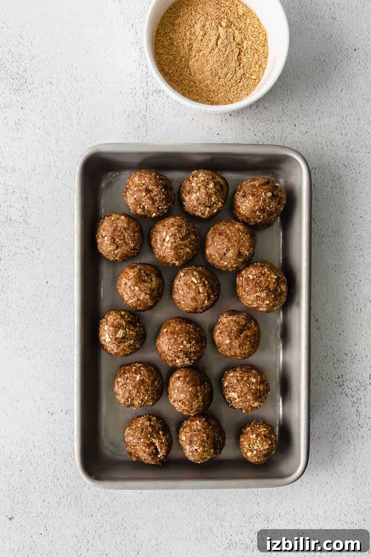 No-Bake Pecan Pie Energy Balls Recipe 5 Pecan pie energy balls on a baking sheet.
