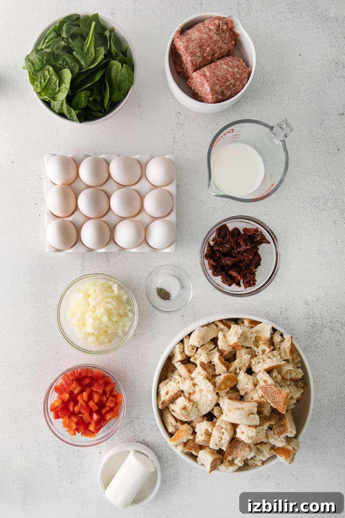 Make-Ahead English Muffin Breakfast Casserole 3 Sausage, eggs, sun dried tomatoes, milk, and other breakfast bake ingredients.