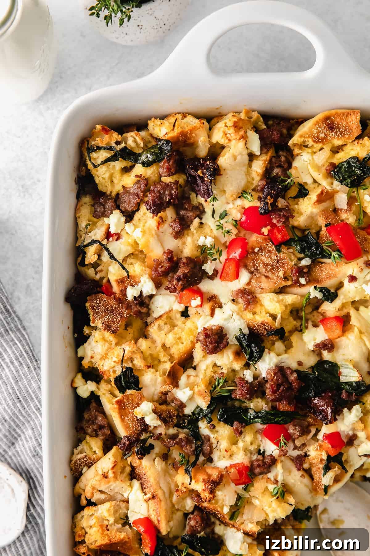 Make-Ahead English Muffin Breakfast Casserole 7 English muffin breakfast bake topped with fresh thyme.